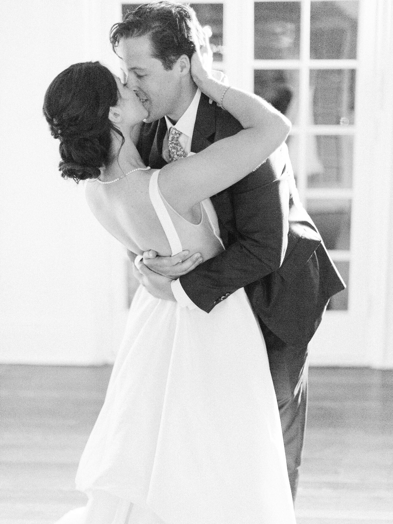 candid photograph of the bride and groom's first dance during their wedding at the rcyc toronto