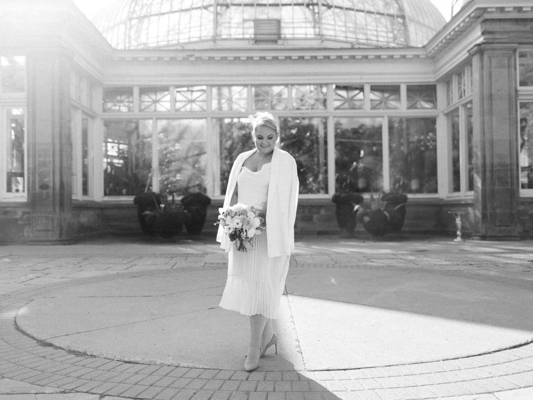 bride posing naturally for candid wedding photographs at her intimate allen gardens elopement