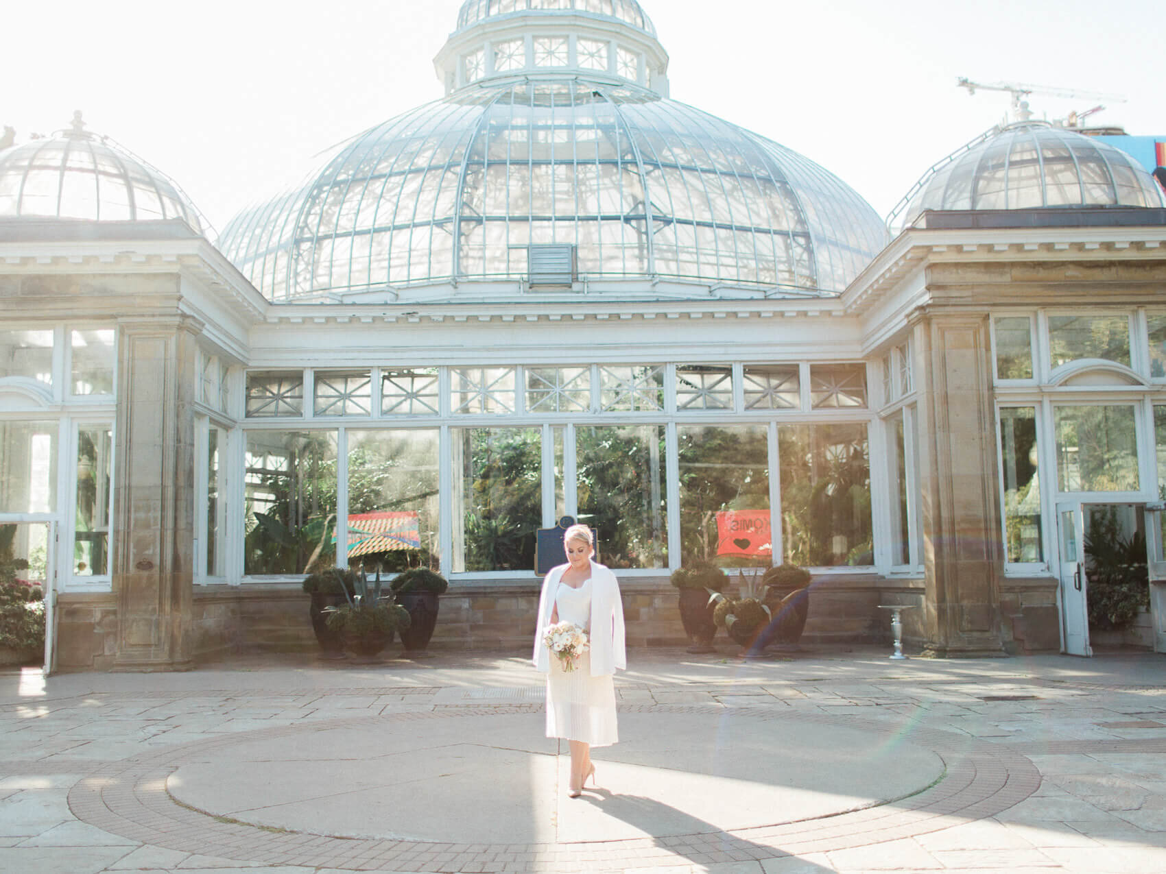 bride posing naturally for candid wedding photographs at her intimate allen gardens elopement