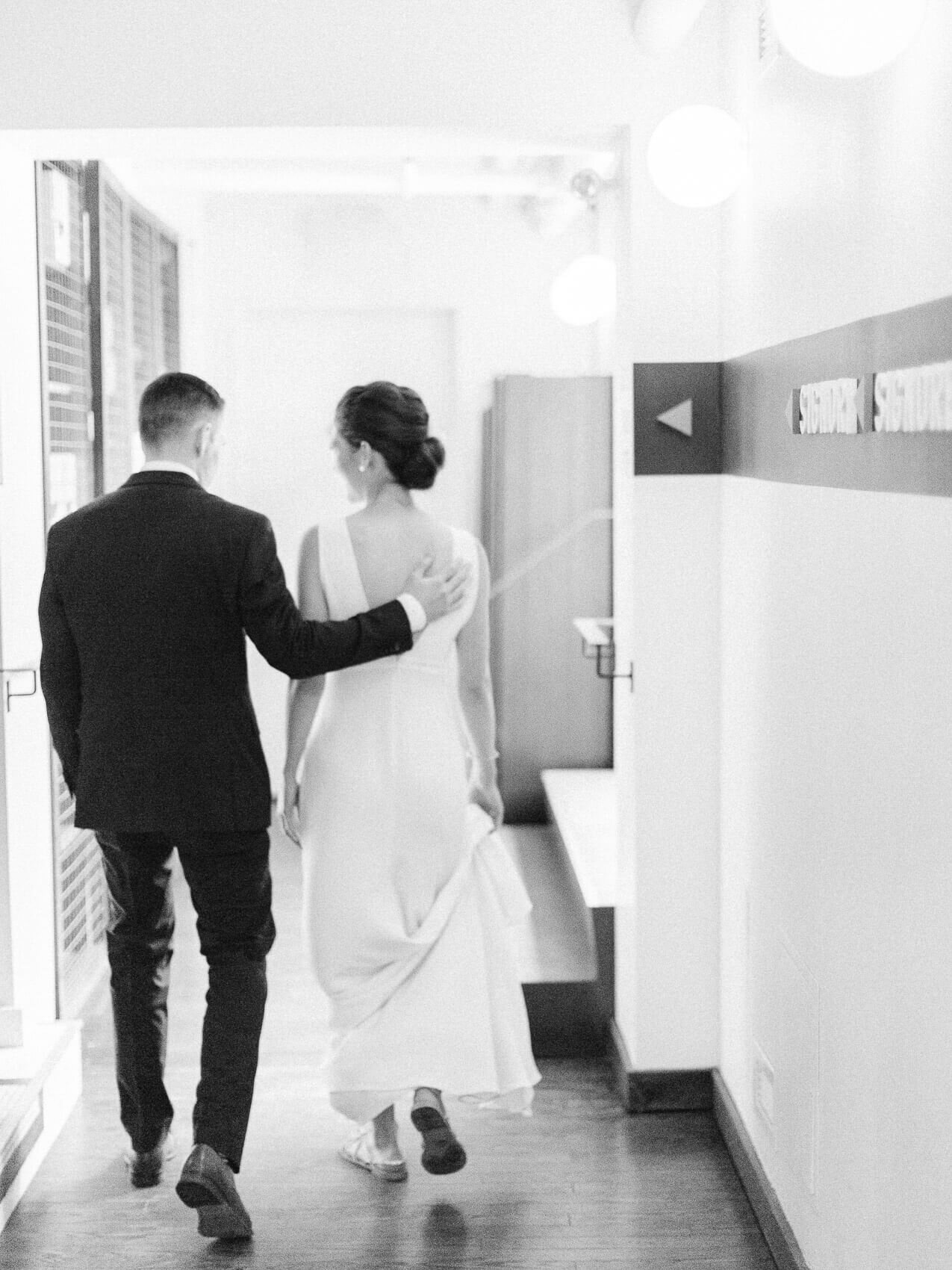 candid and natural posing of bride and groom from an intimate downtown toronto wedding at terroni restaurant