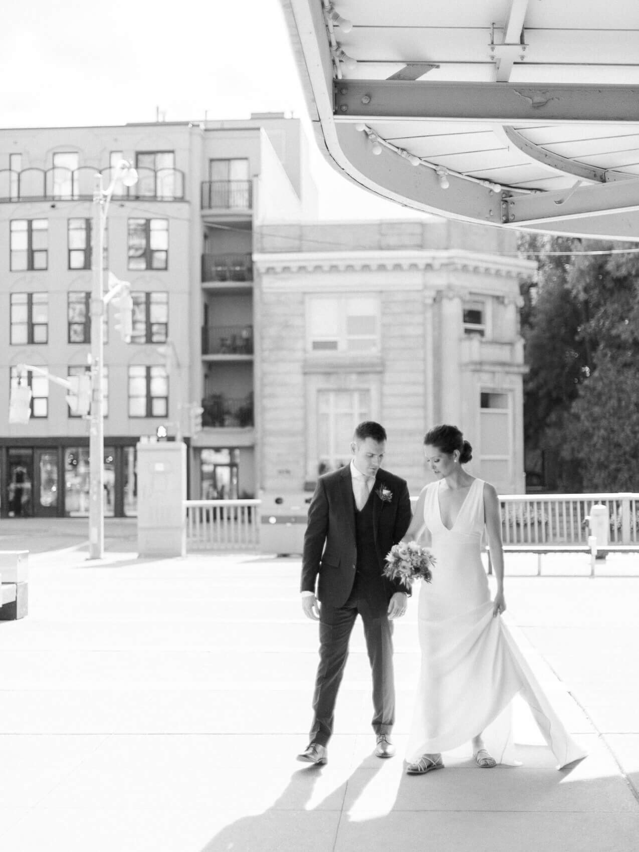 candid and natural posing of bride and groom on rooftop from an intimate downtown toronto wedding at terroni restaurant