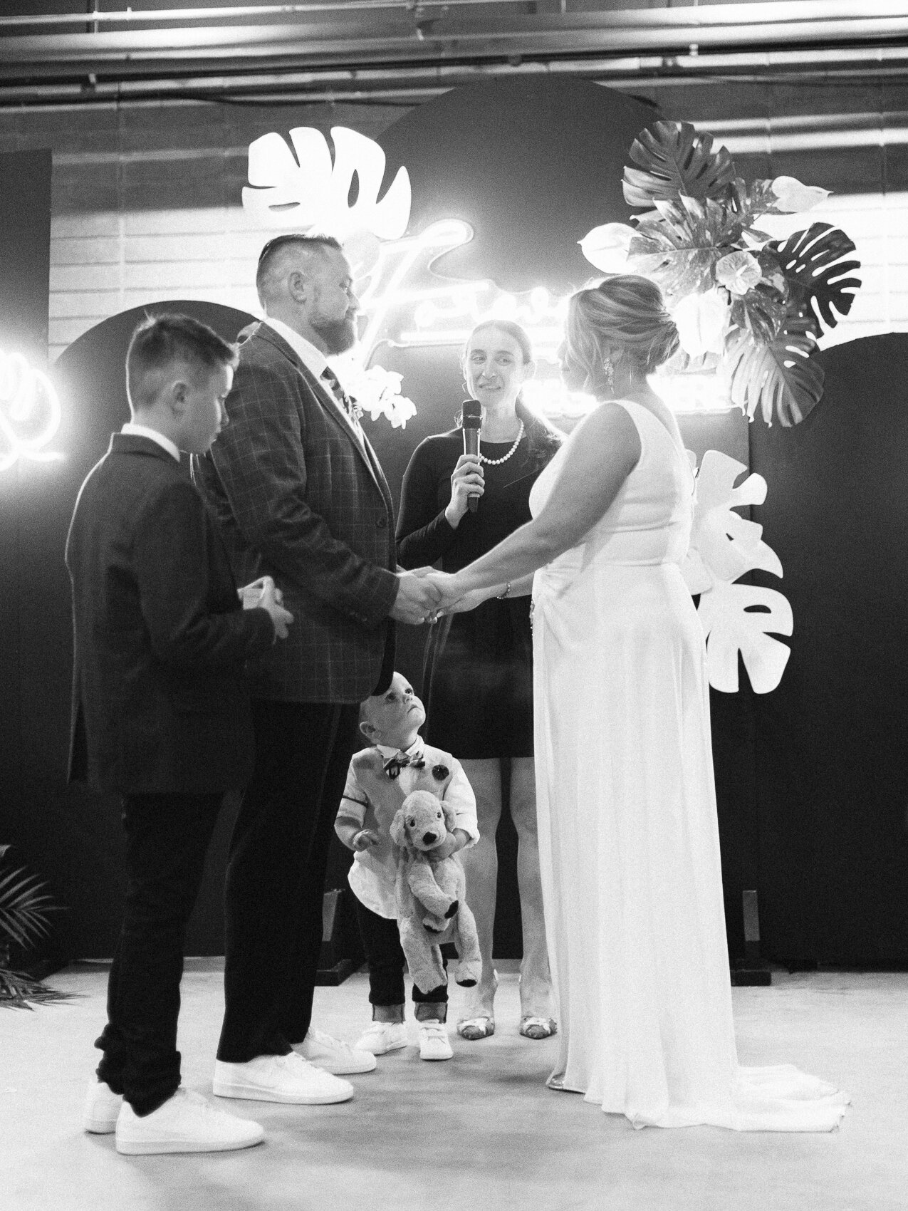 couple standing at the altar during their intimate wedding ceremony as part of the pop up chapel at the evergreen brickworks