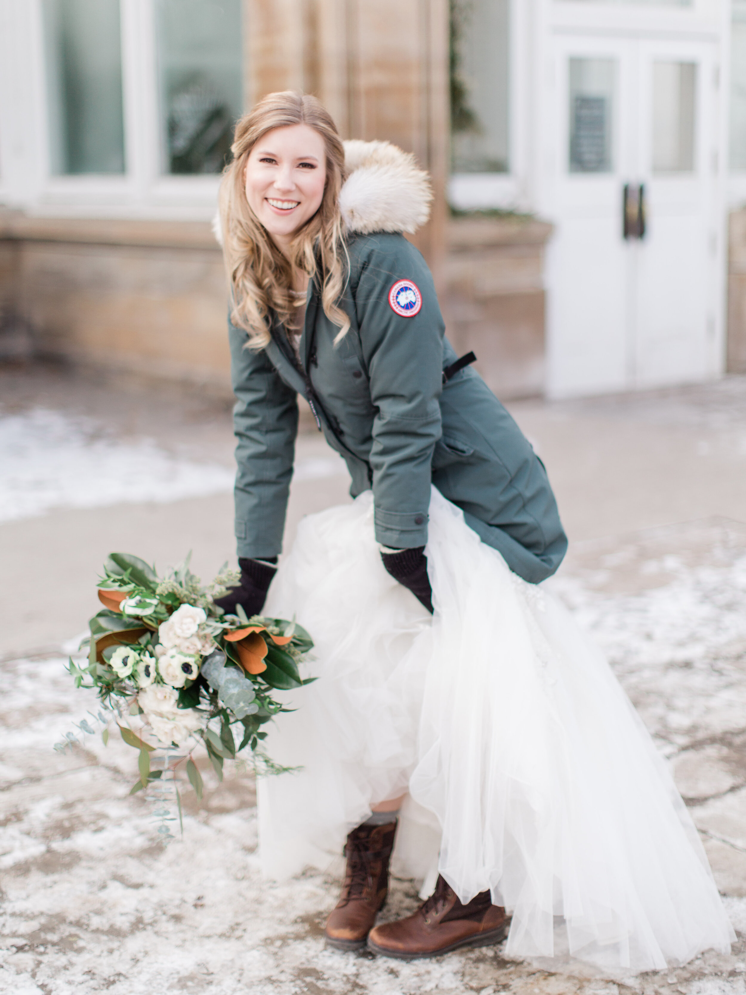 happy bride posing naturally for a portrait at her winter wedding in downtown toronto