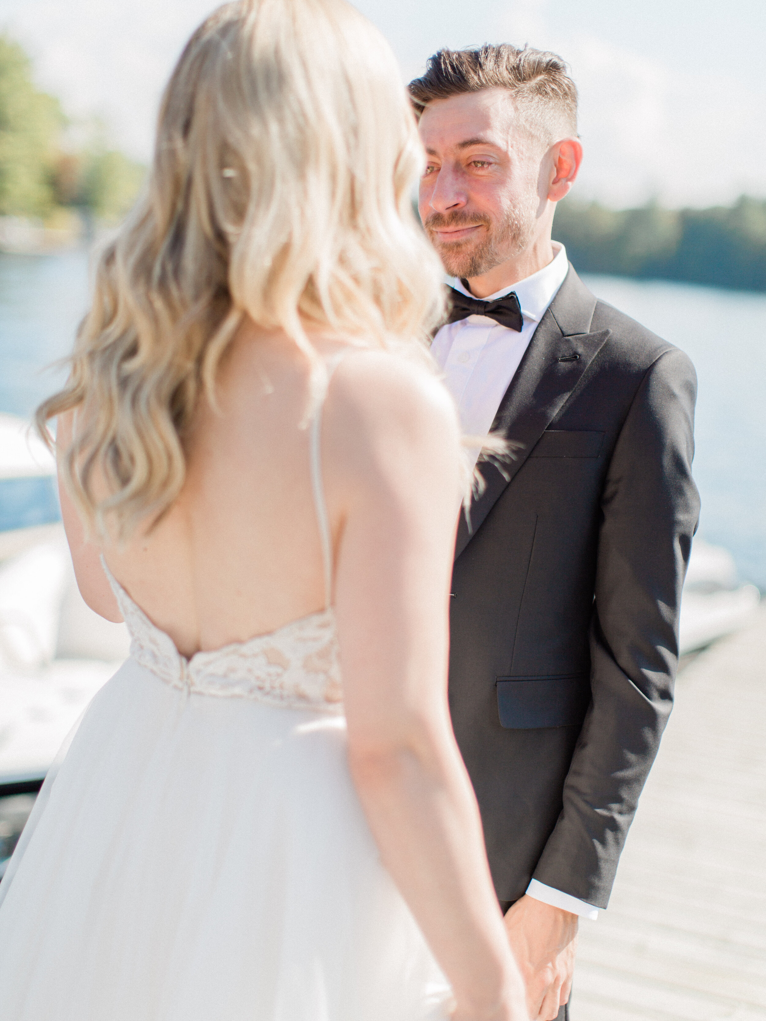 an emotional groom at getting to see his bride for the first time on their wedding day in muskoka