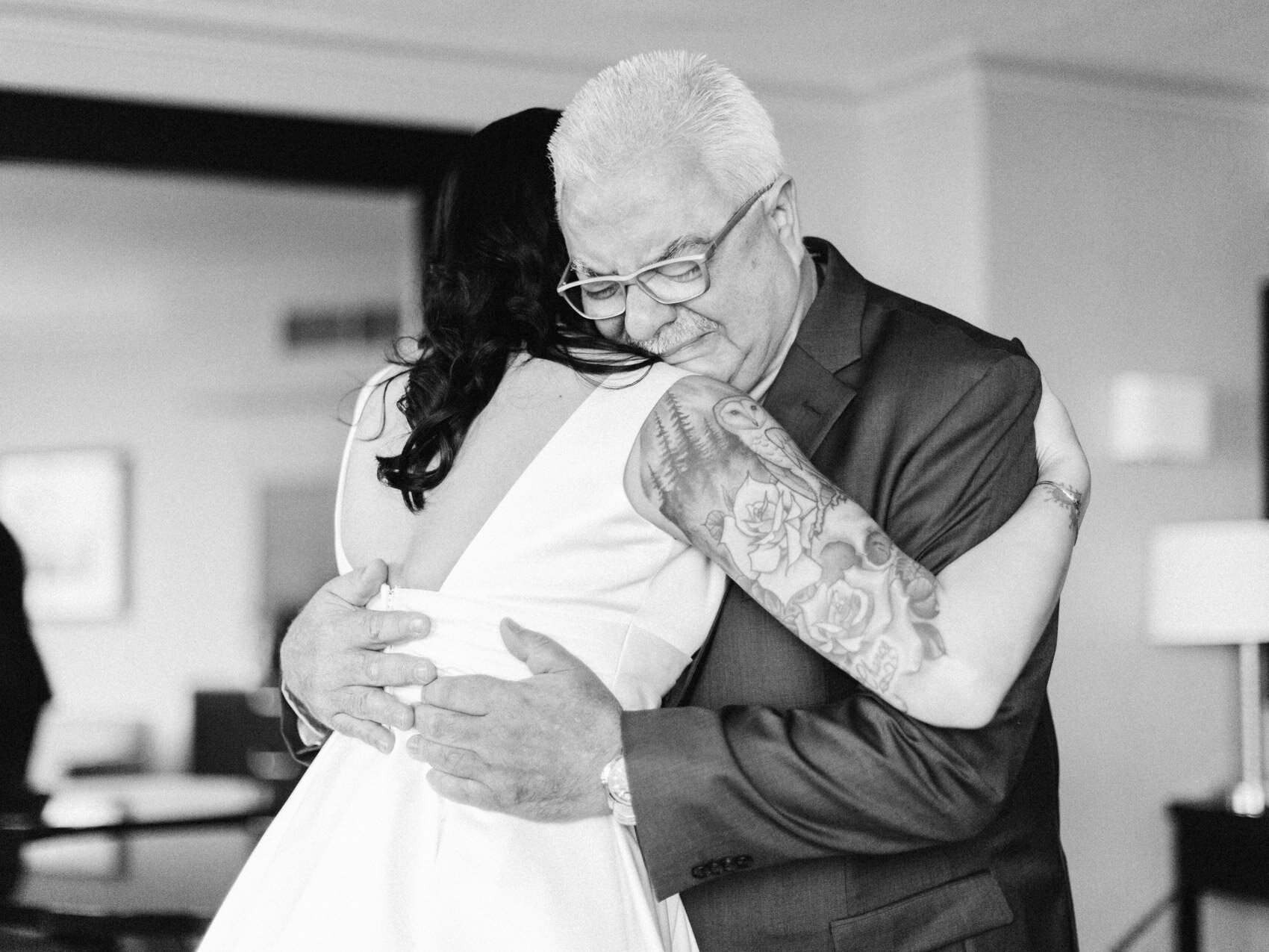an emotional father hugging his daughter on her wedding day in downtown toronto
