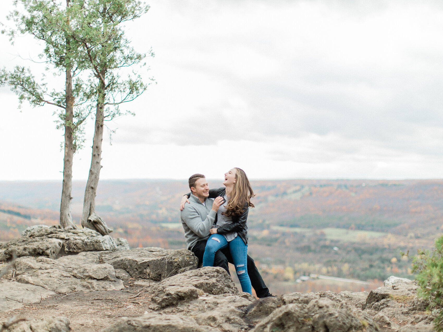 adventure hiking engagement session photograph of adventurous outdoor couple at the top of old baldy in the georgian bay area