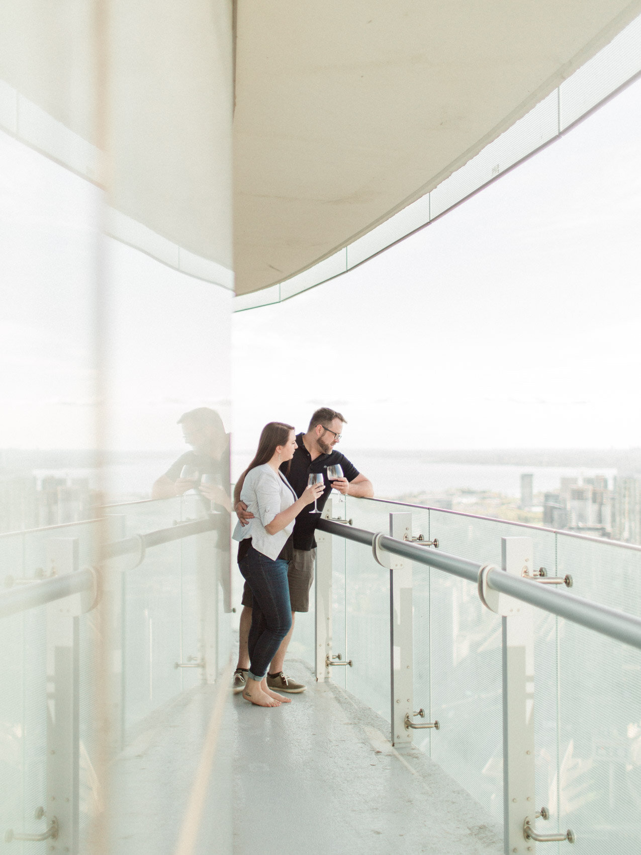 engagement photograph of happy couple at their at home engagement session in downtown toronto