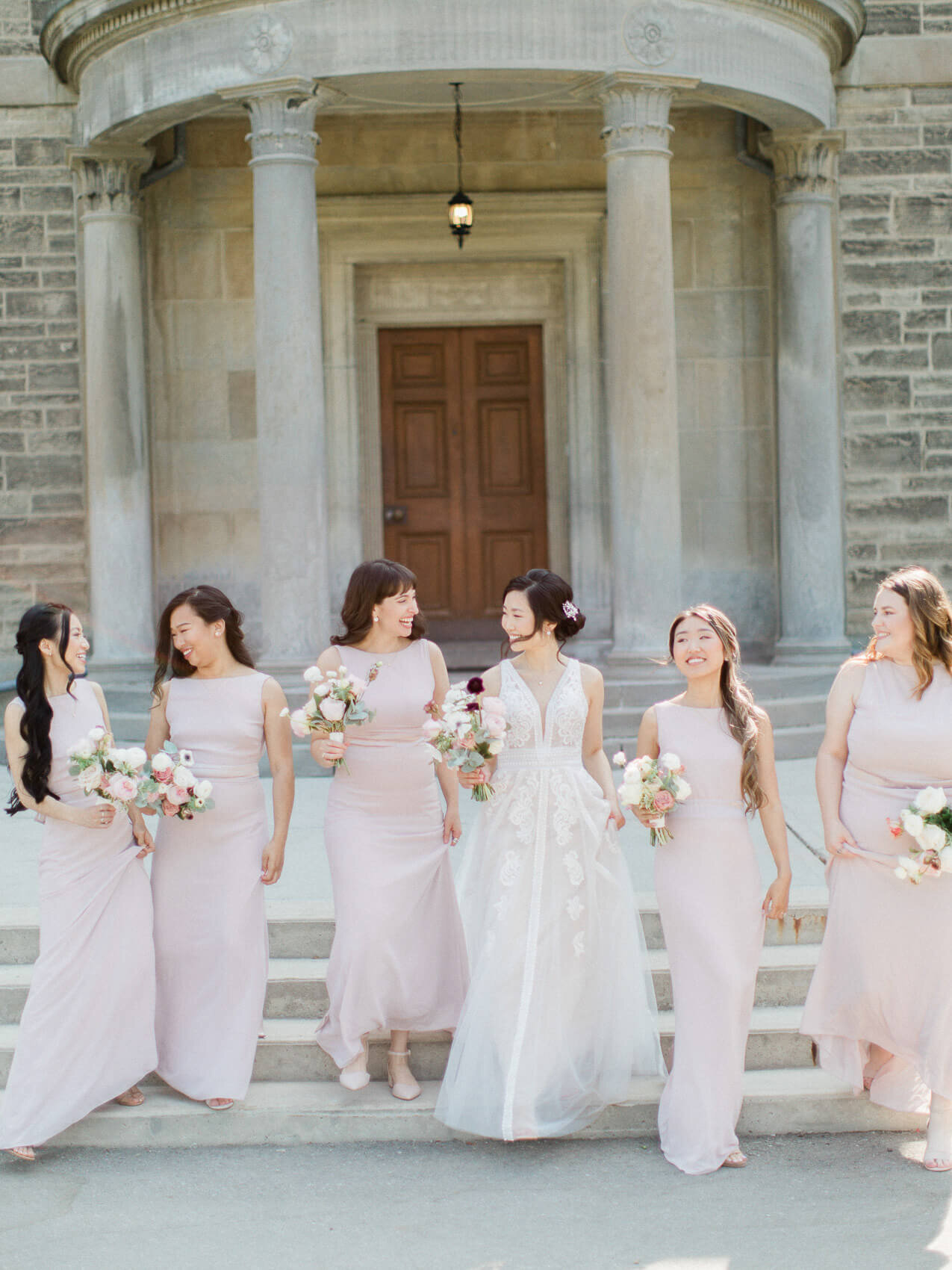candid bridesmaids laughing in wedding at dunlap observatory
