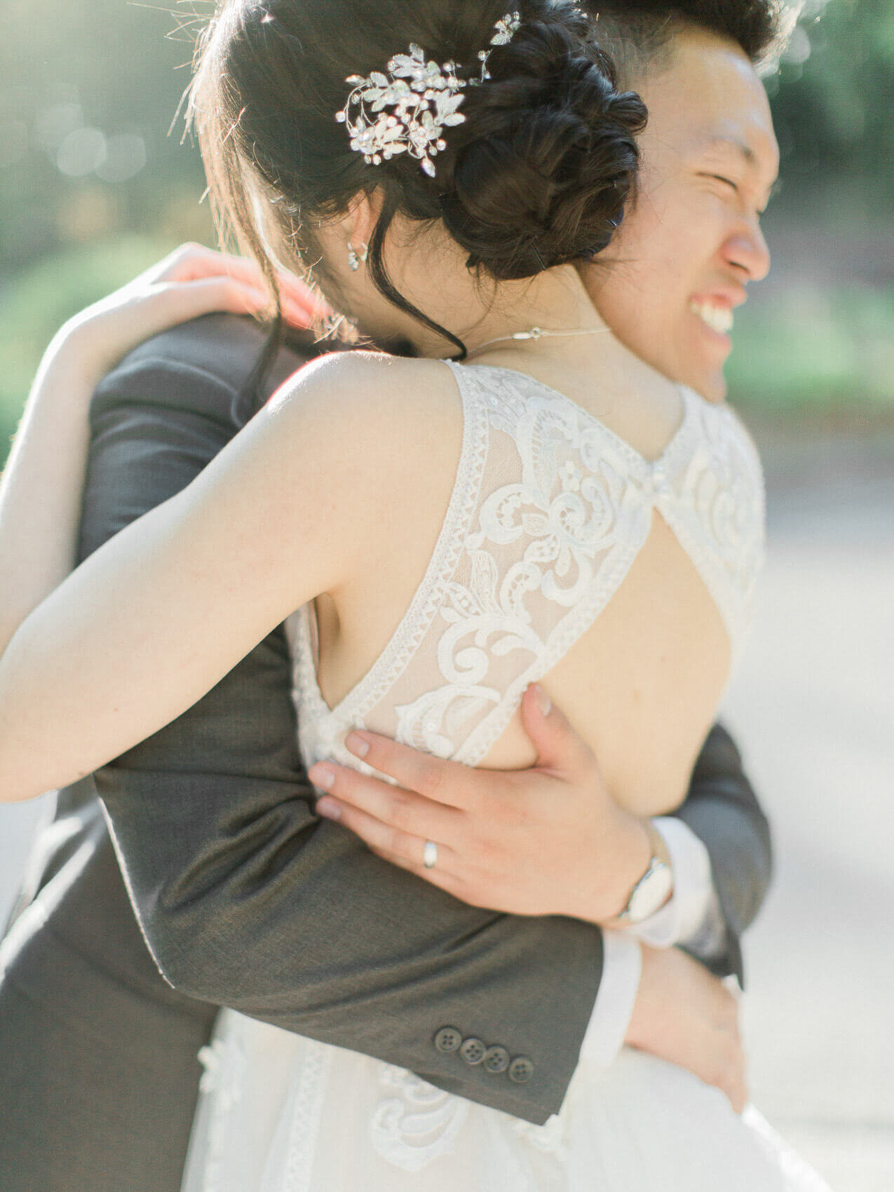 candid bride and groom posing naturally for their wedding photographs at the manor