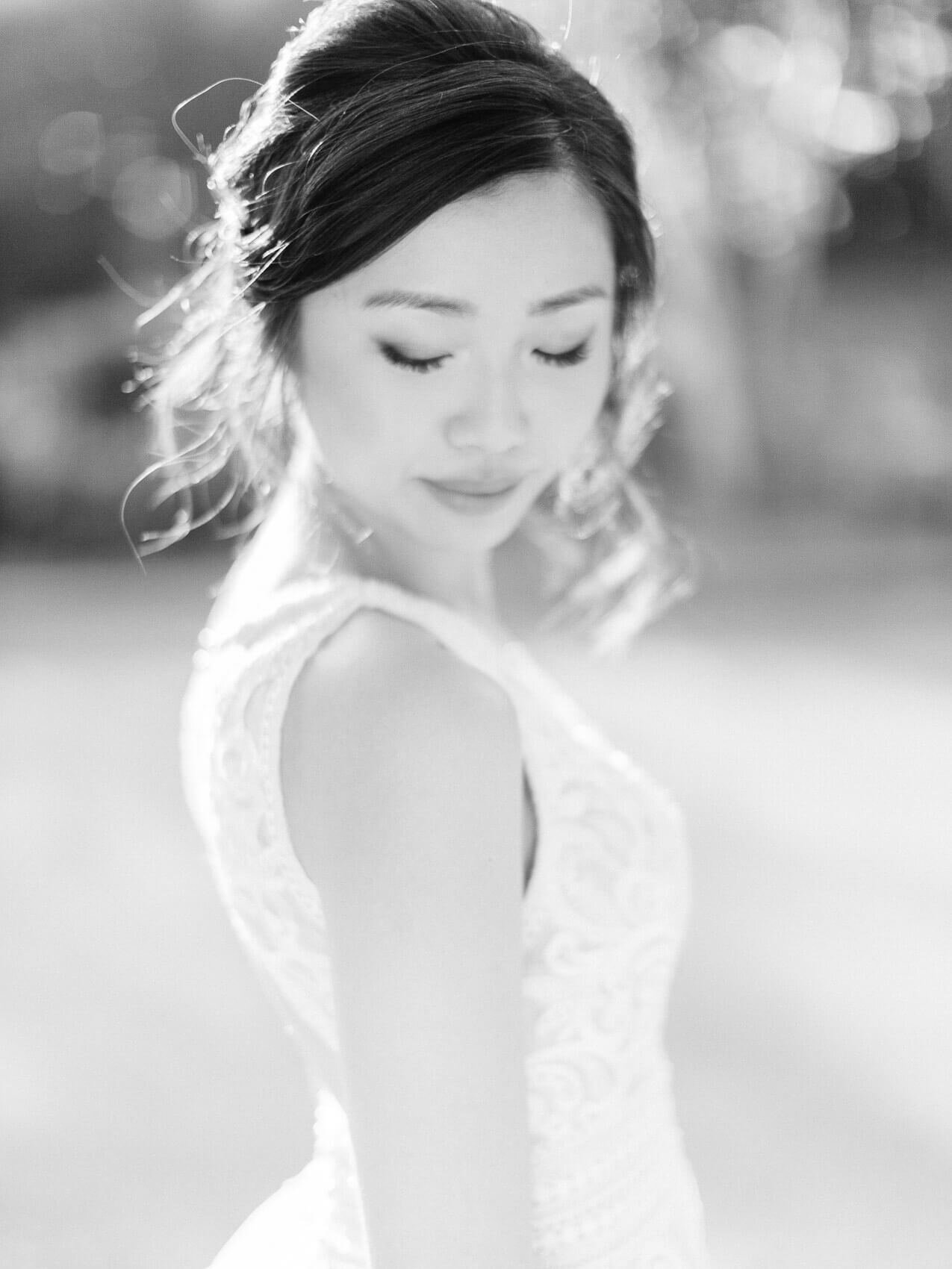 bride posing naturally for her wedding photos at the manor.  Soft romantic hairstyle and minimal natural makeup.