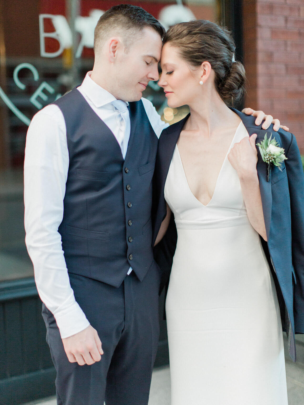 bride and groom posing naturally at their intimate terroni restaurant wedding