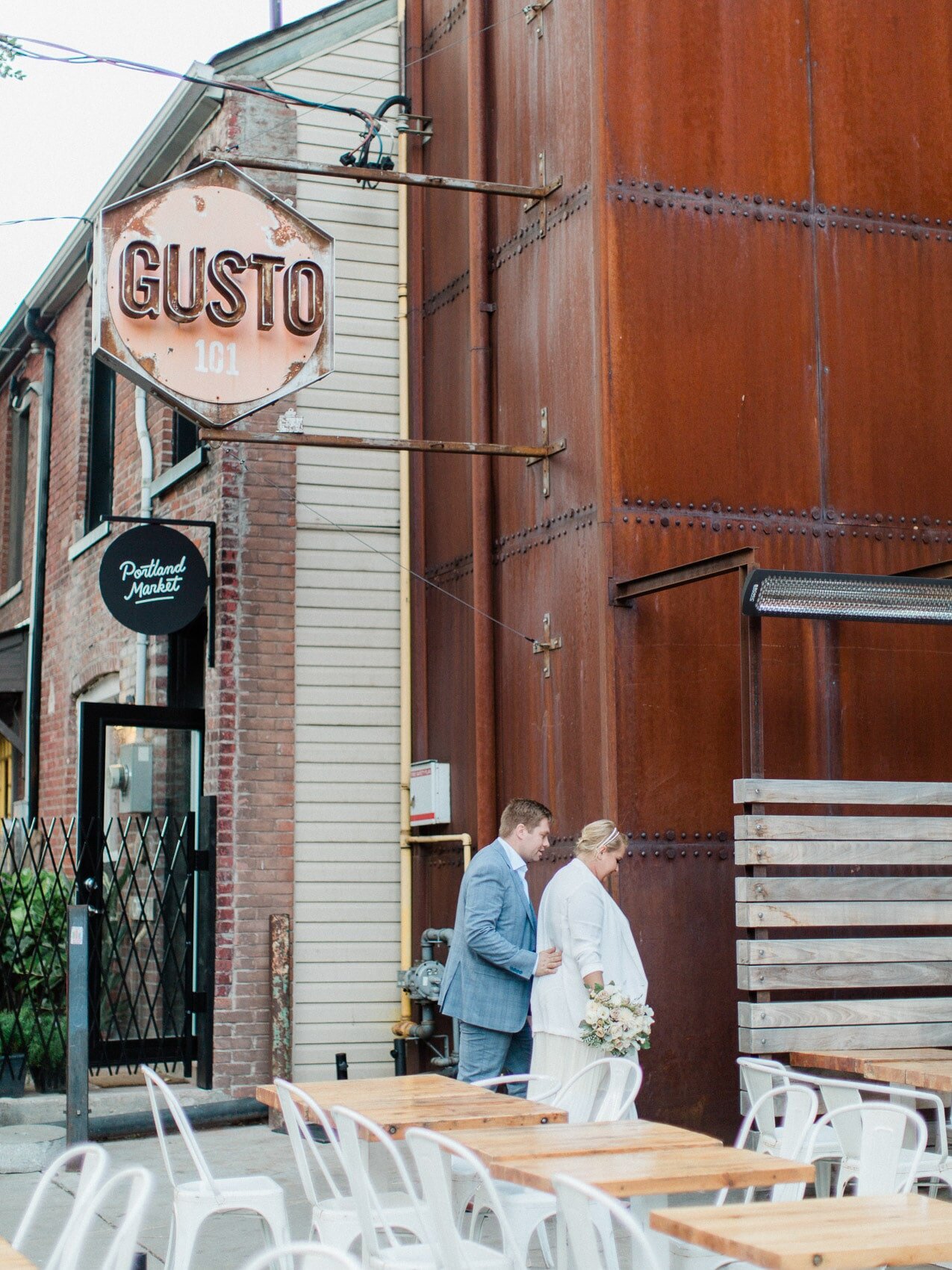 candid couple posing naturally for their wedding photos at their elopement at gusto 101
