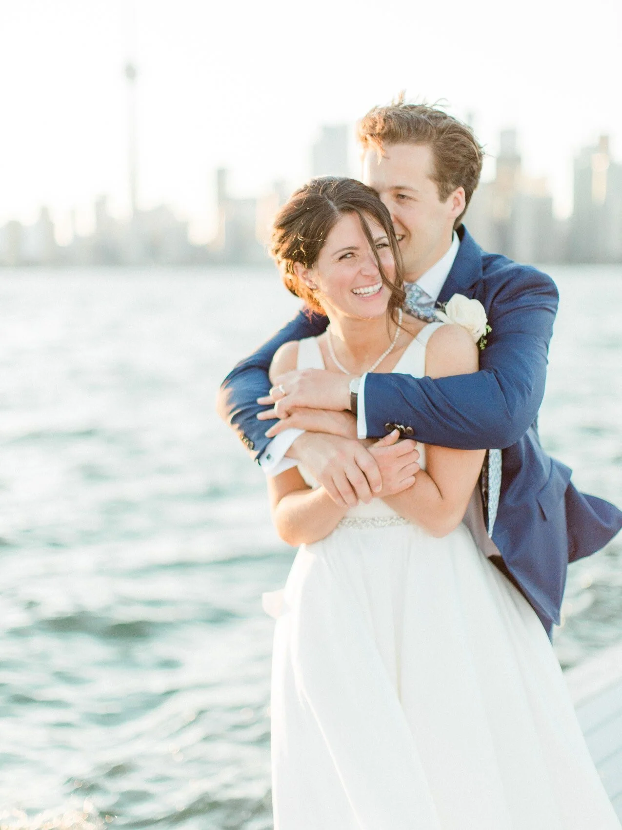 couple posing naturally together for wedding photographs at the rcyc
