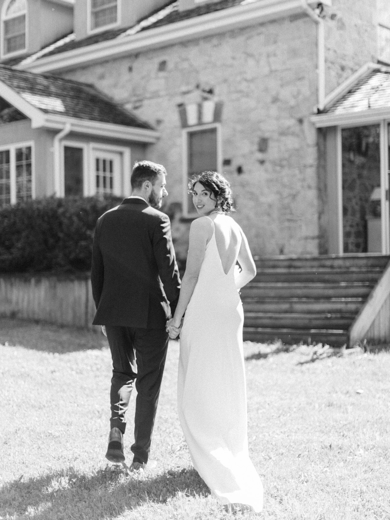 bride and groom pose naturally at their outdoor summer wedding at silver springs retreat