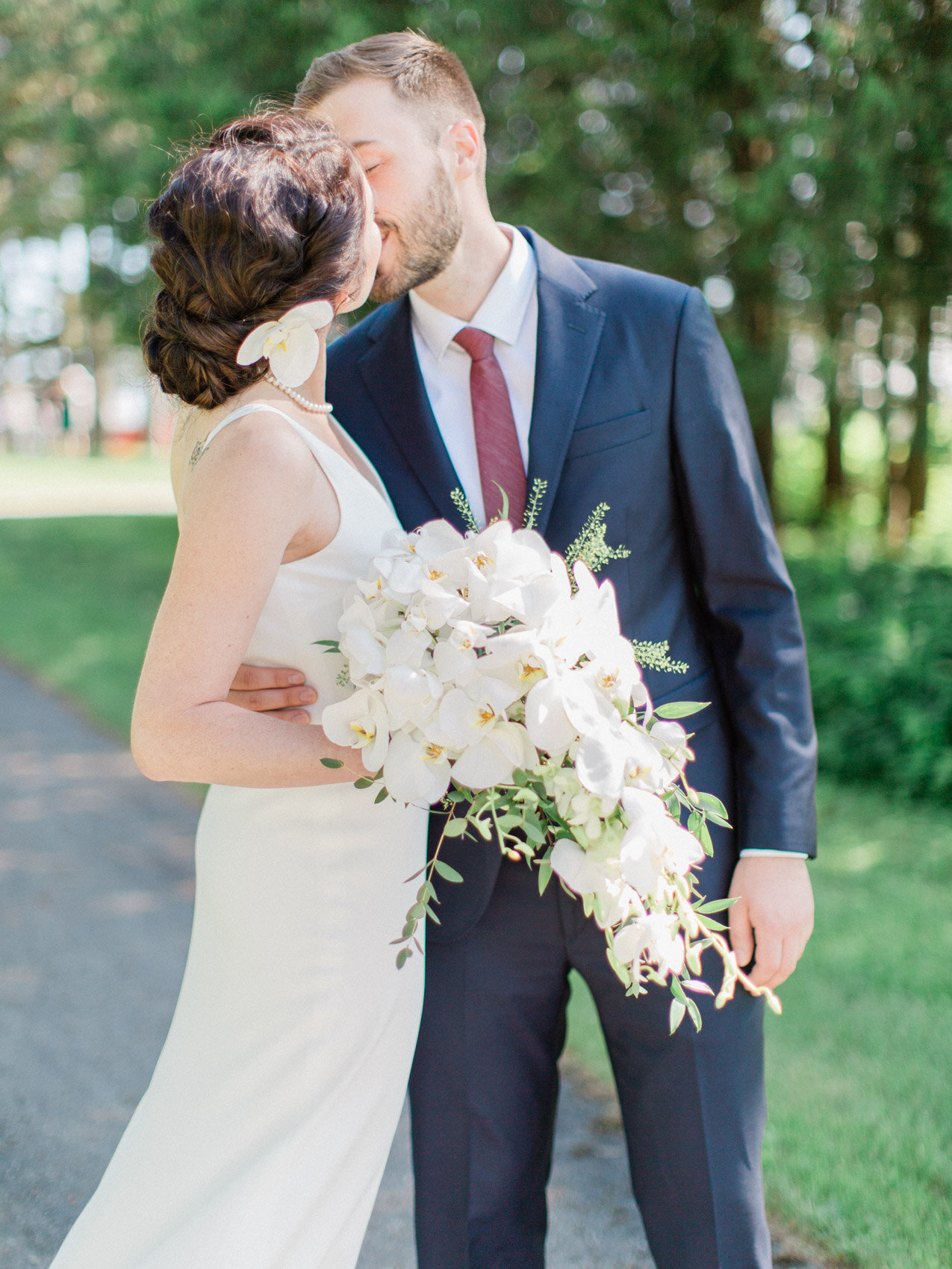 bride and groom pose naturally at their outdoor summer wedding at silver springs retreat