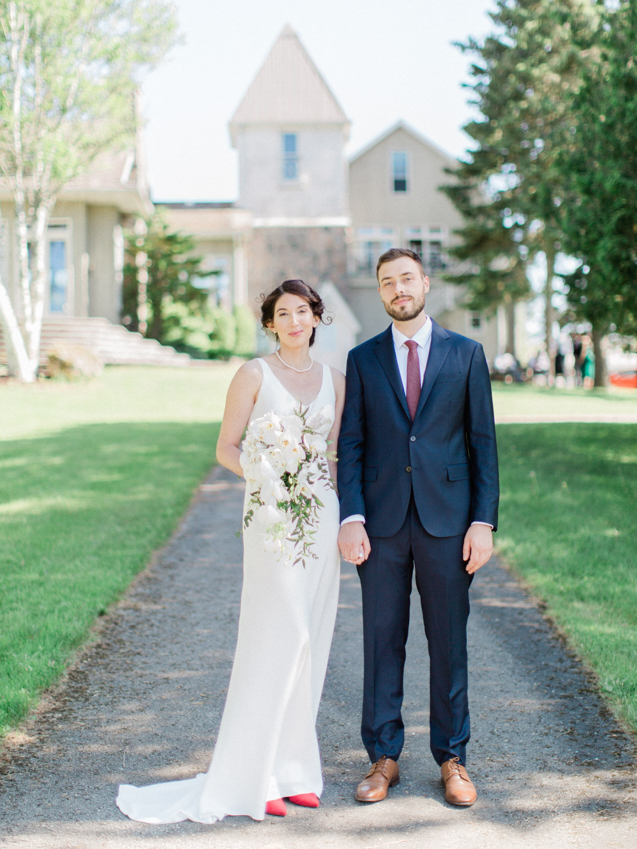 bride and groom pose naturally at their outdoor summer wedding at silver springs retreat