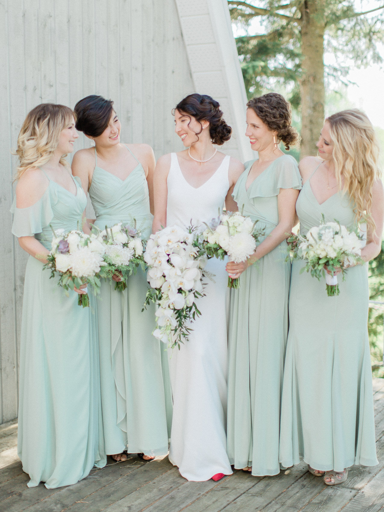 Bride and bridesmaids having fun together for some candid photos at silver springs retreat