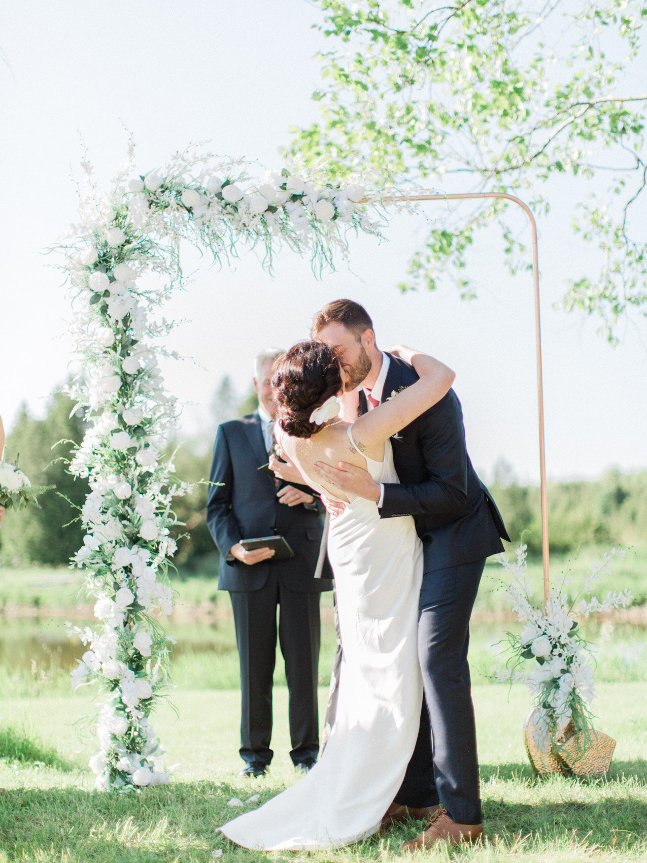 candid photo of outdoor summer wedding ceremony at silver springs retreat
