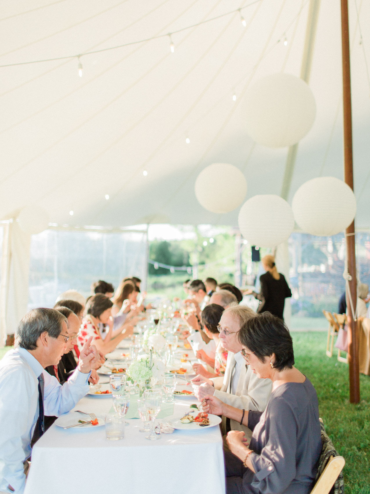 candid cheers at an outdoor summer wedding reception at silver springs retreat