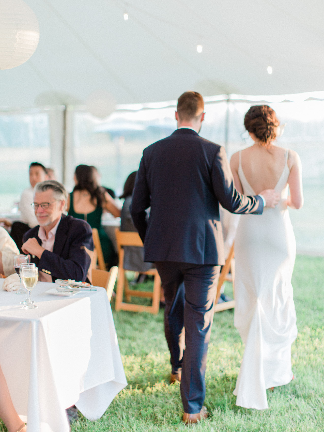 candid cheers at an outdoor summer wedding reception at silver springs retreat