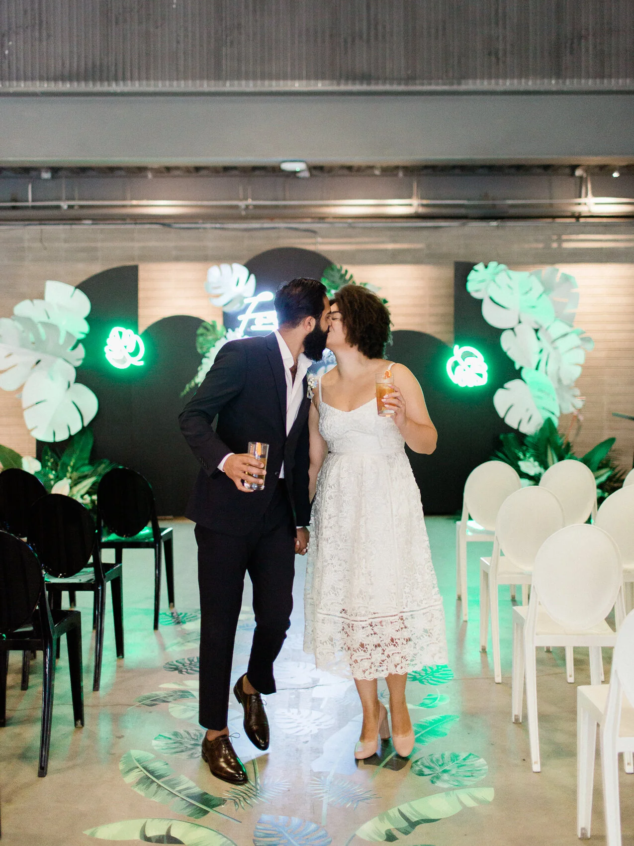 cute biracial couple poses naturally for wedding photos after their elopement at the evergreen brickworks