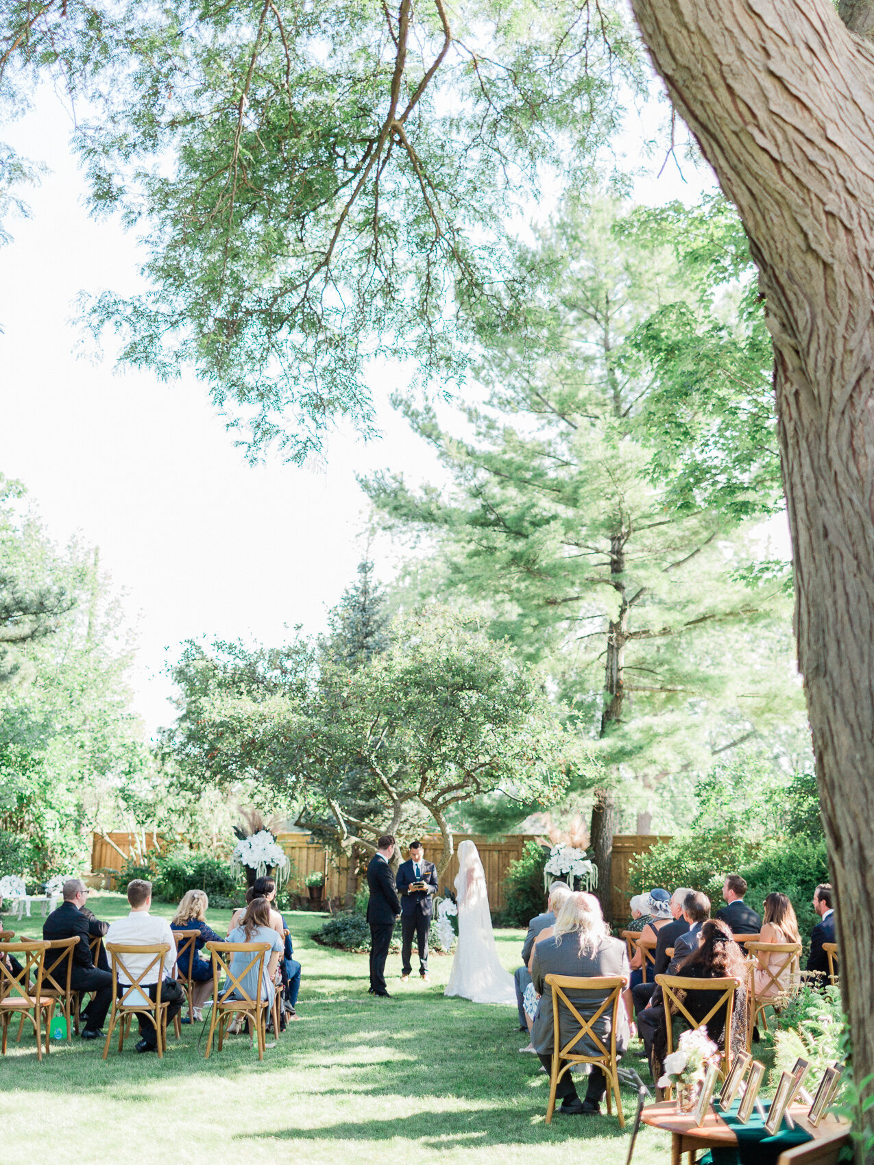 a couple getting married at a small backyard wedding