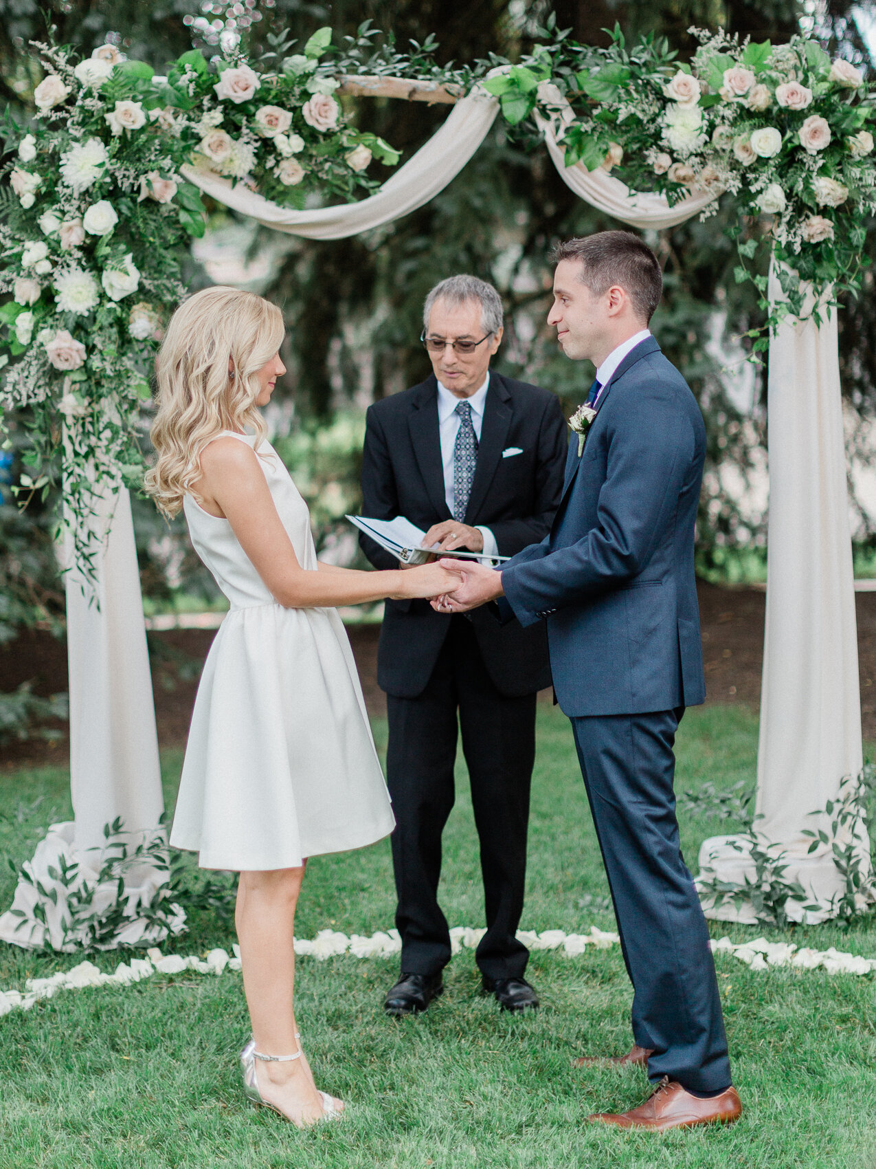 a couple get married at an intimate backyard wedding