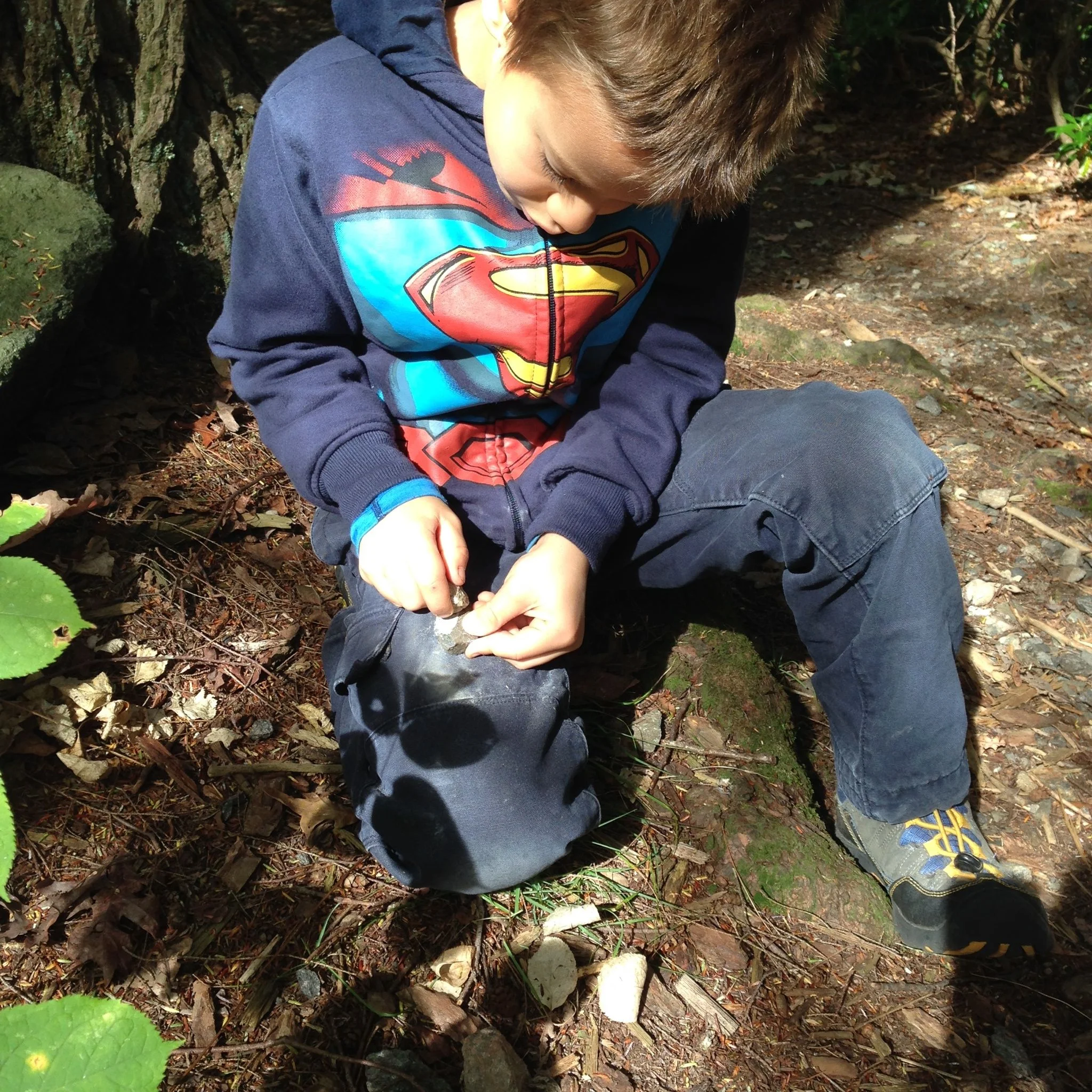 Spontaneous stone work practice session in the middle of the trail (editor's note: they have been studying flintknapping with Drew on Wednesdays and Thursdays). Silas and Kunsang were interested to discover the relative hardness of various rocks.