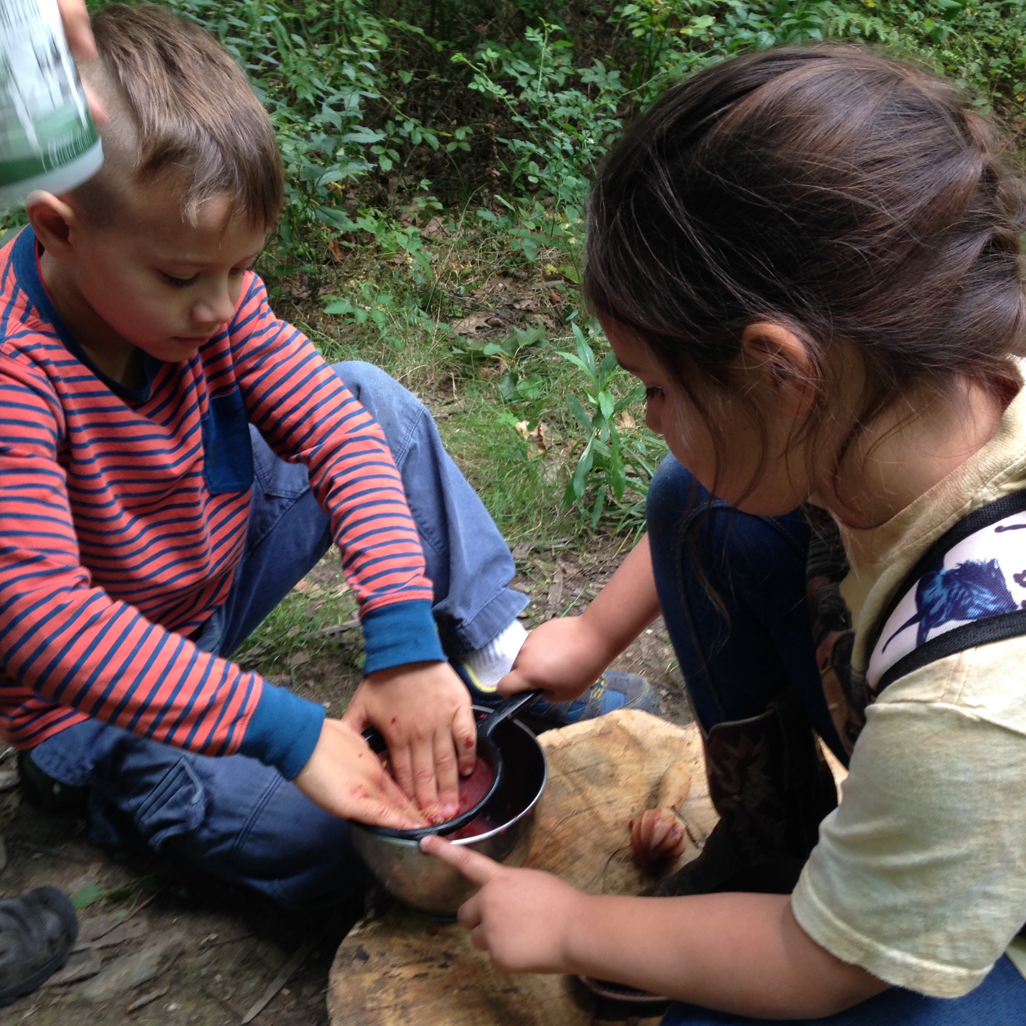 Silas, Tess, and Kunsang worked as a team to process the fruit