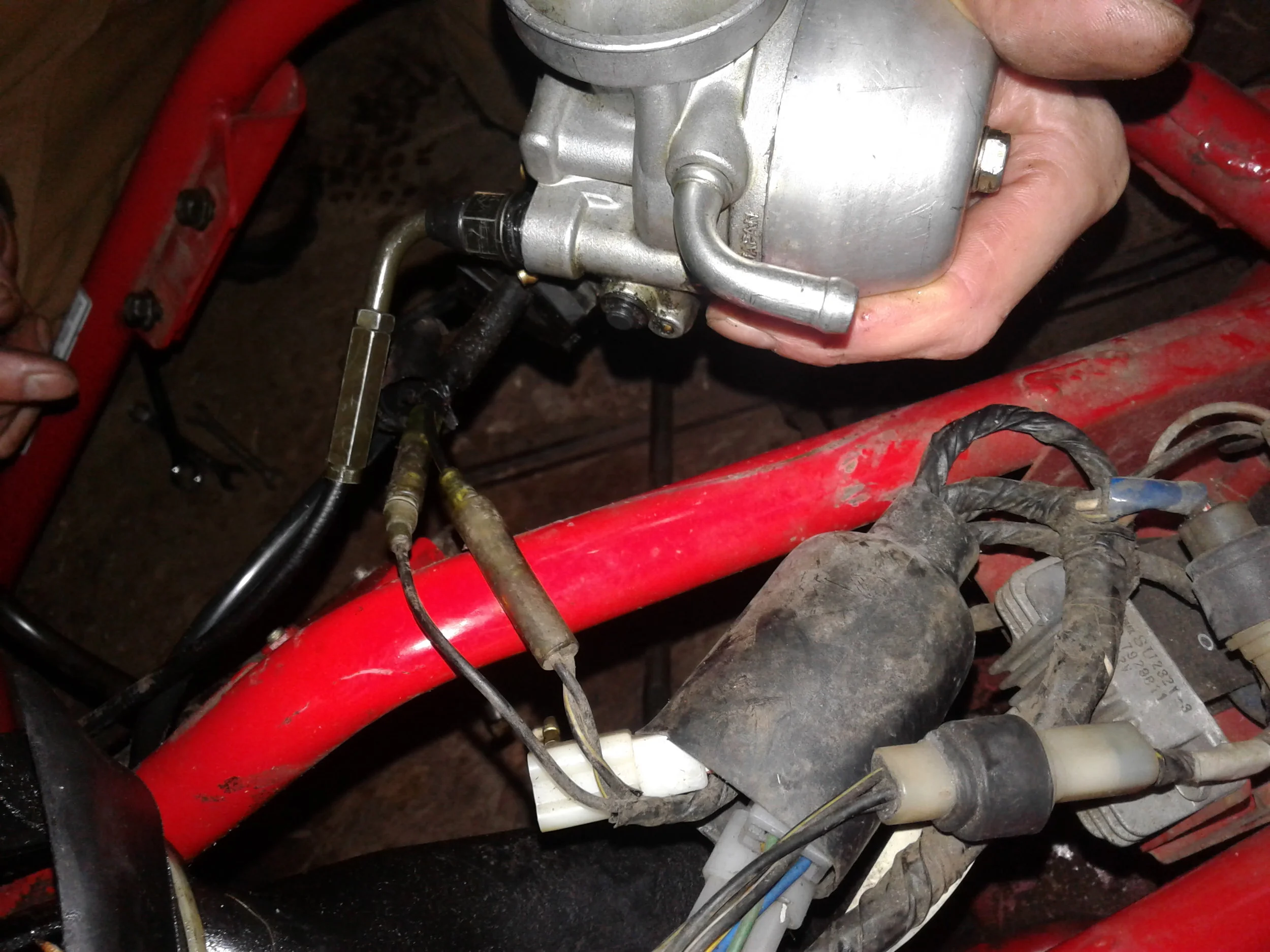 This is the carburetor that we removed along with some wiring. Eventually we had to disconnect all the wiring on both snowmobiles because one was an electric start and one was not. 