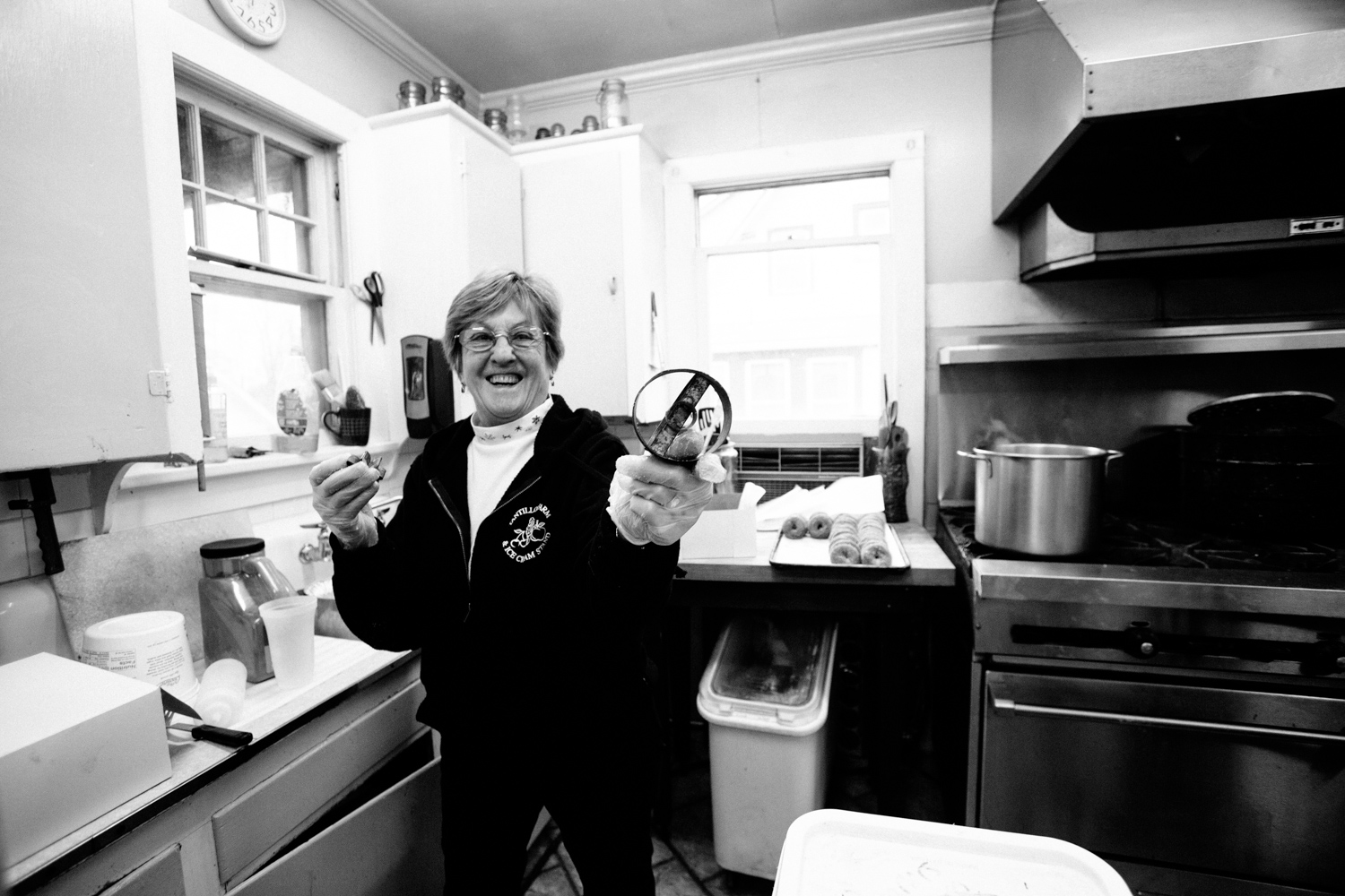  Grandma shows off her mother's doughnut cutter -- the first one used by the orchard. 