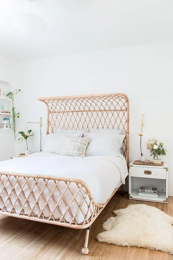 A rattan bed - WANT! Throughout these room photos, you are seeing rattan paired with white walls - because it just works! I love the open lattice rattan pattern of this bed against the fresh white wall. The rattan bed makes such an impact here, to keep the room serene the other elements are simple and solid. Me likey.