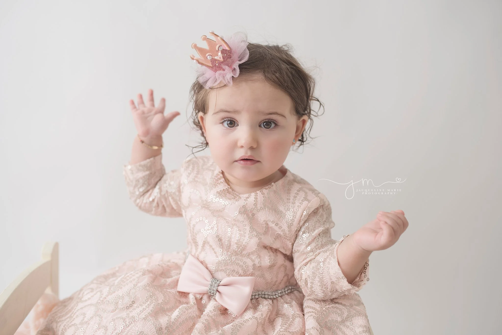 first birthday portrait features baby girl wearing pink crown for birthday pictures in columbus ohio 