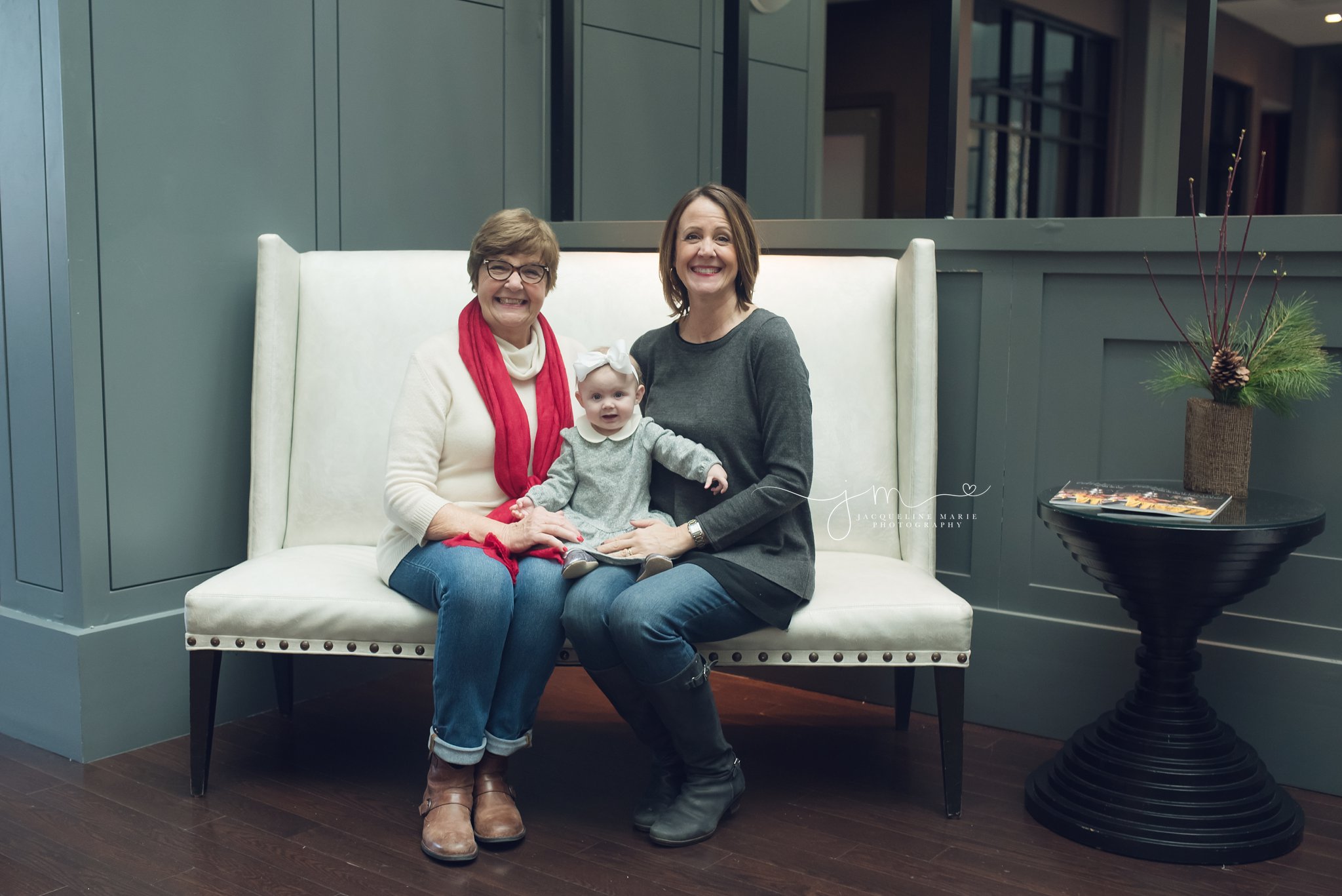 three generations are featured in this image with granddaughter grandmother and great grandmother for family portrait session in columbus ohio