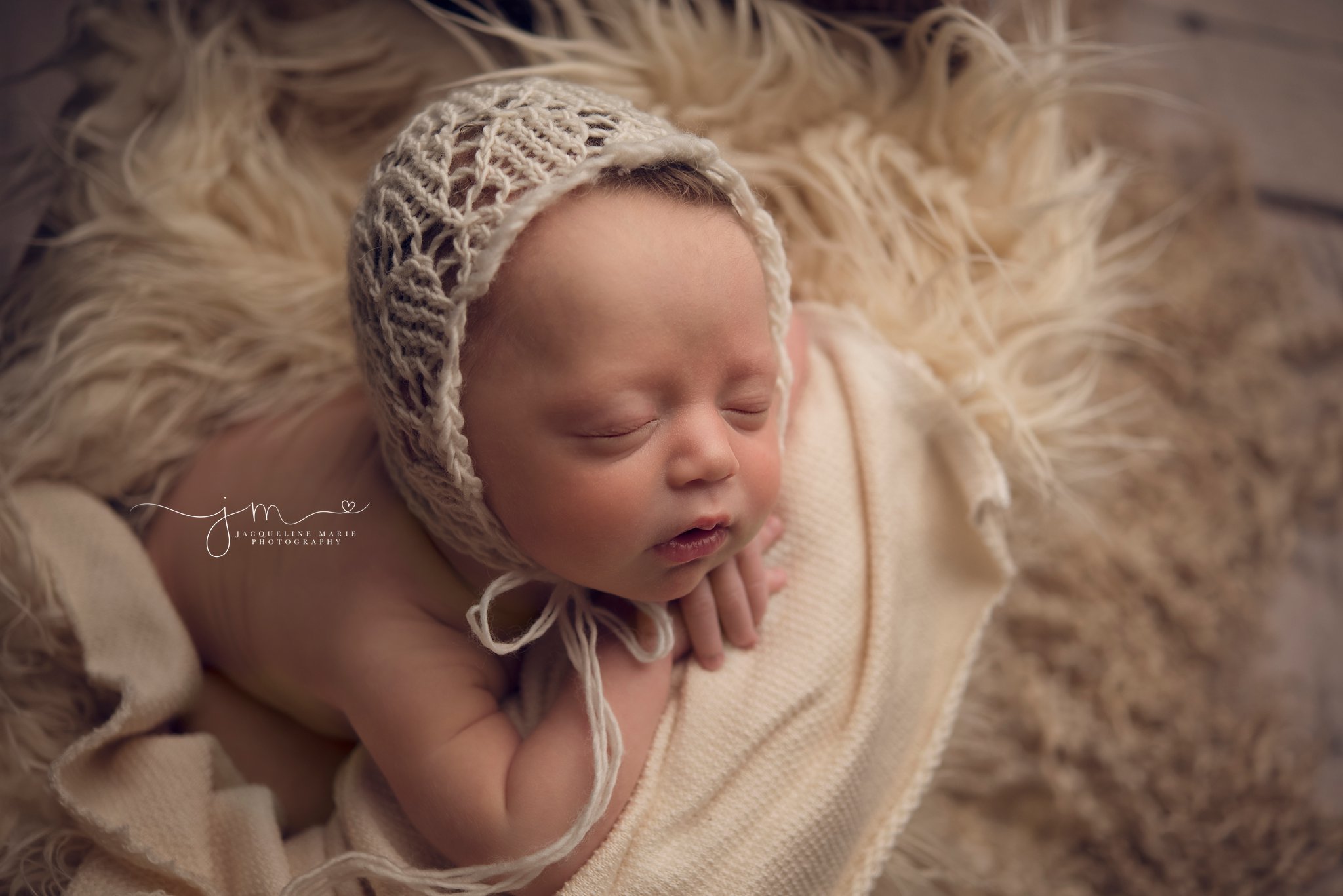 columbus ohio newborn photographer captures newborn baby girl in cream bonnet for newborn mentoring session with Photograpy by axis design in toccoa georgia