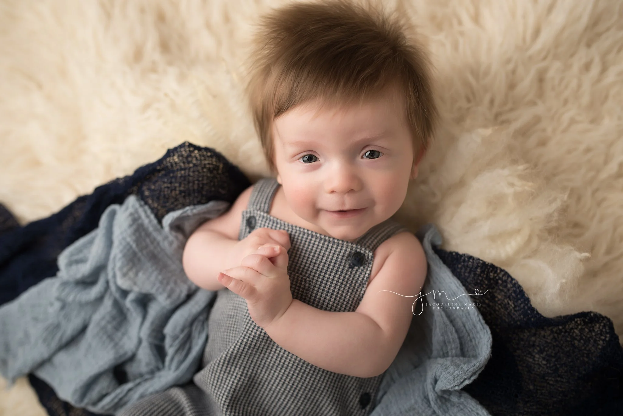 columbus ohio three month old baby boy wears navy blue romper from janie and jack for milestone photography session