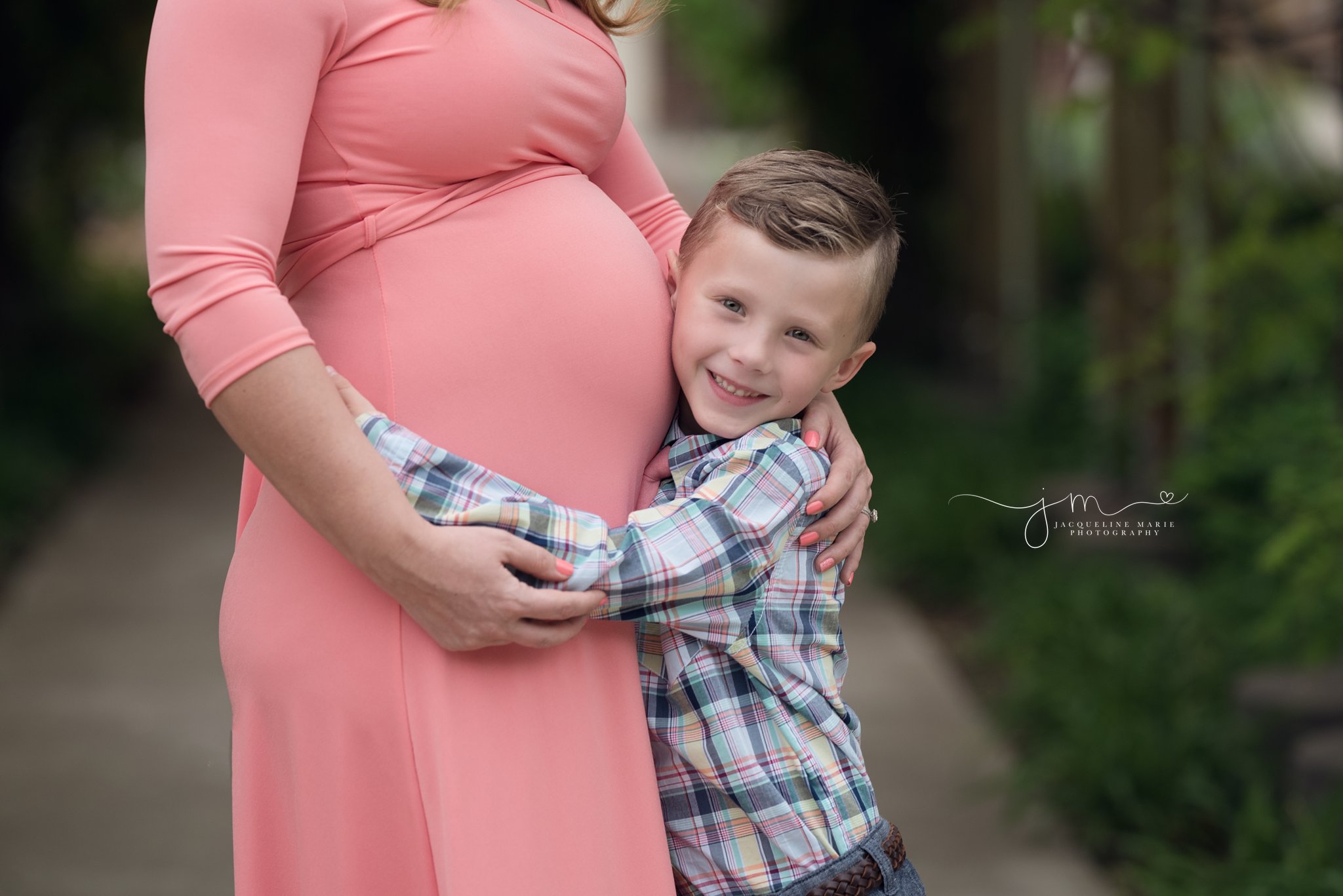 big brother hugs mothers belly for pregnancy pictures in columbus ohio