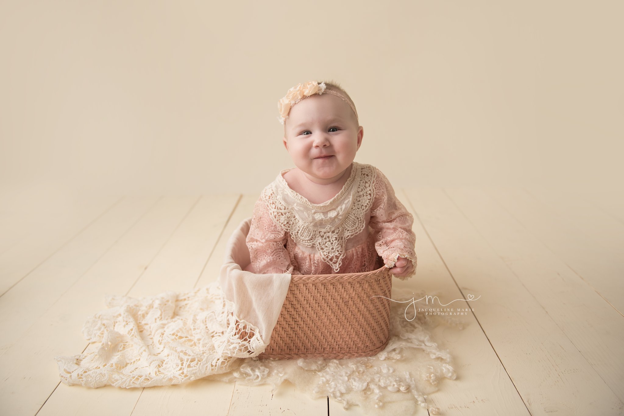 columbus ohio baby photographer features images of sophia wearing pink lace romper and sitting in pink vintage basket