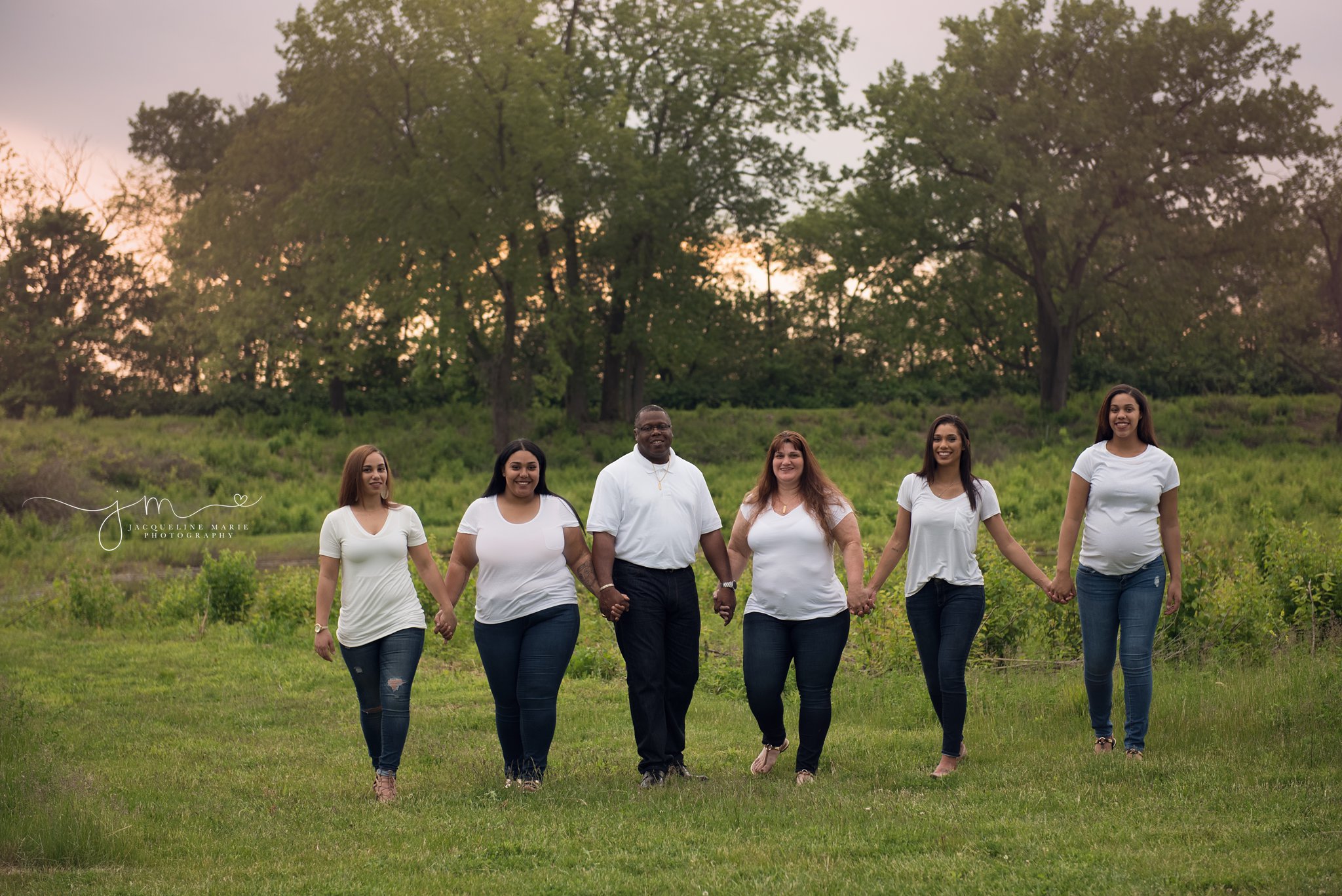 columbus ohio family photographer features images of mother and father walking with four daughters 