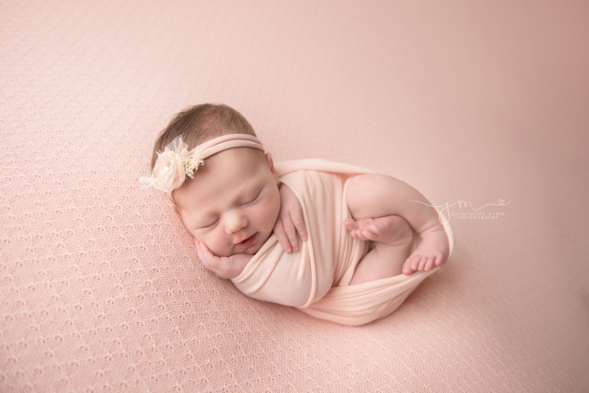 columbus ohio newborn photographer features images of baby girl wrapped in pink swaddle