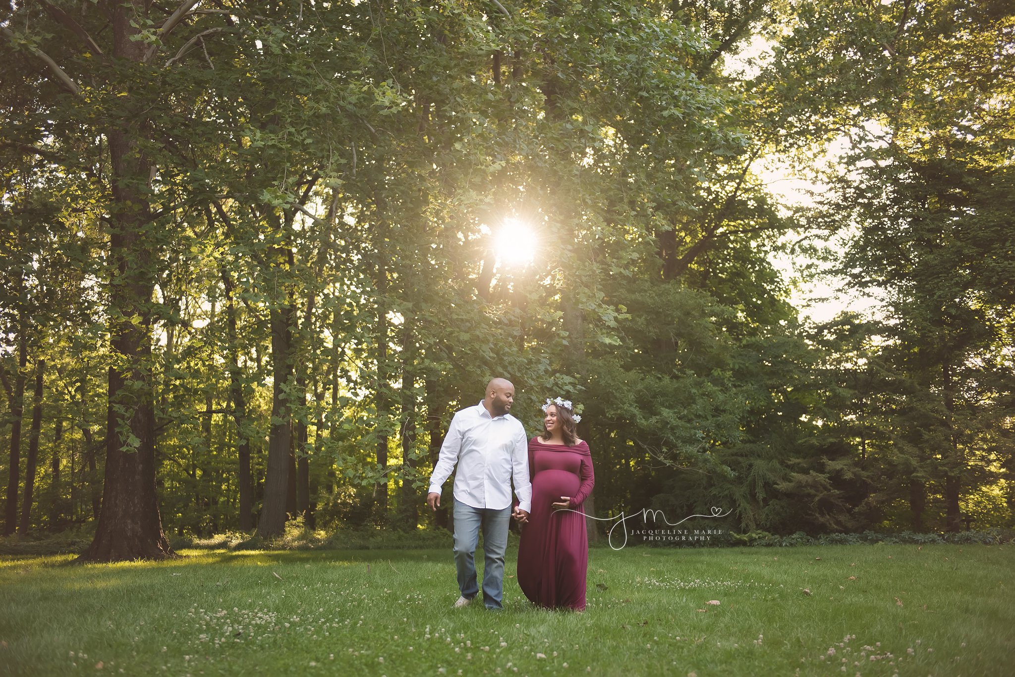 new parents to be walk and hold hands at sunset for maternity and pregnancy pictures in columbus ohio