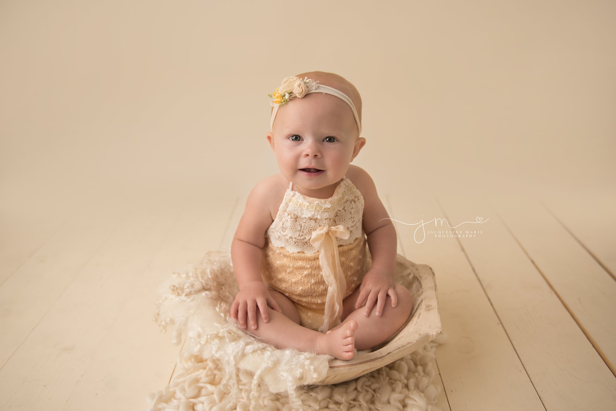 columbus ohio newborn and child photographer features image of baby girl wearing yellow romper