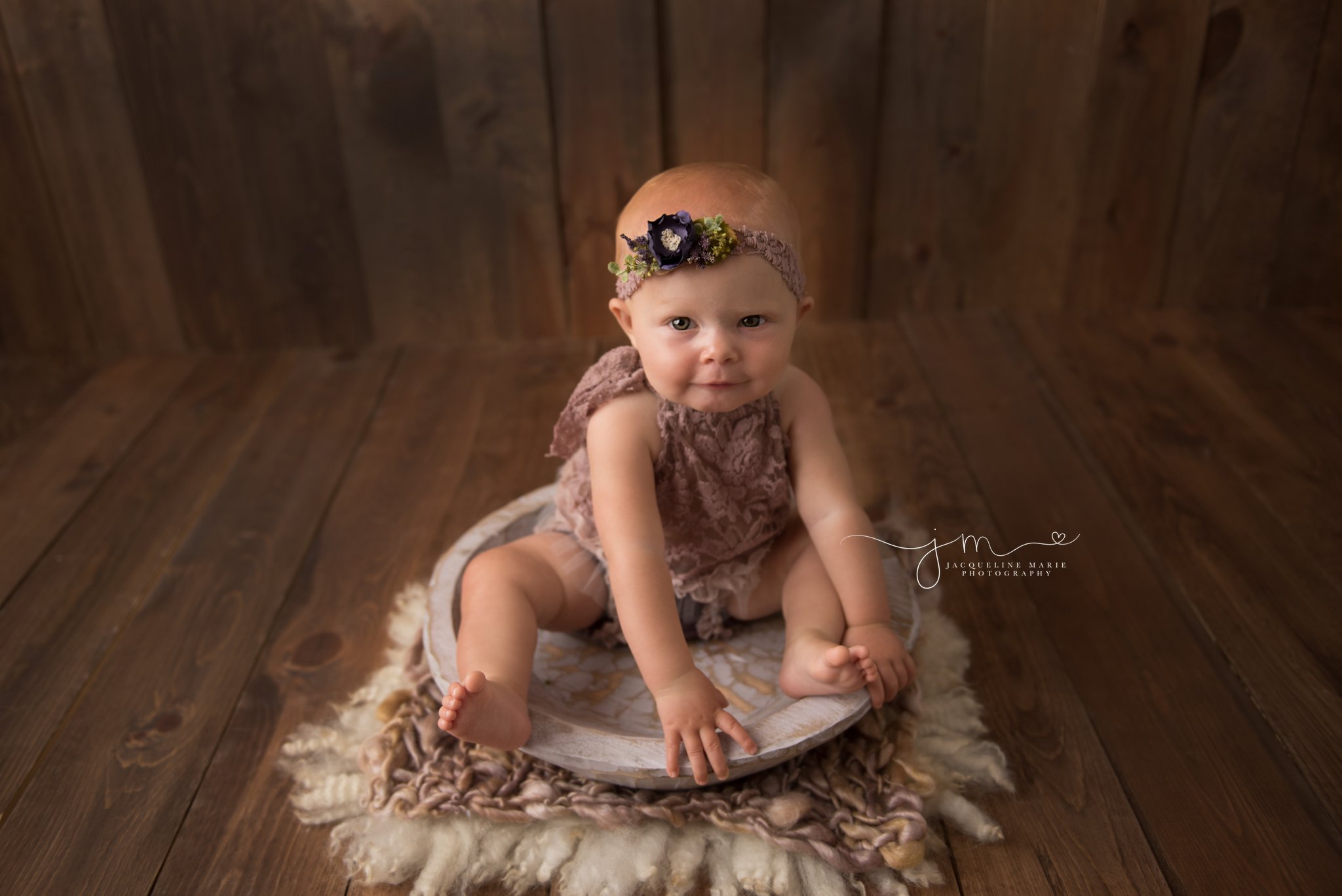 columbus ohio baby photographer features image of 8 month old baby sitting on purple wood bowl