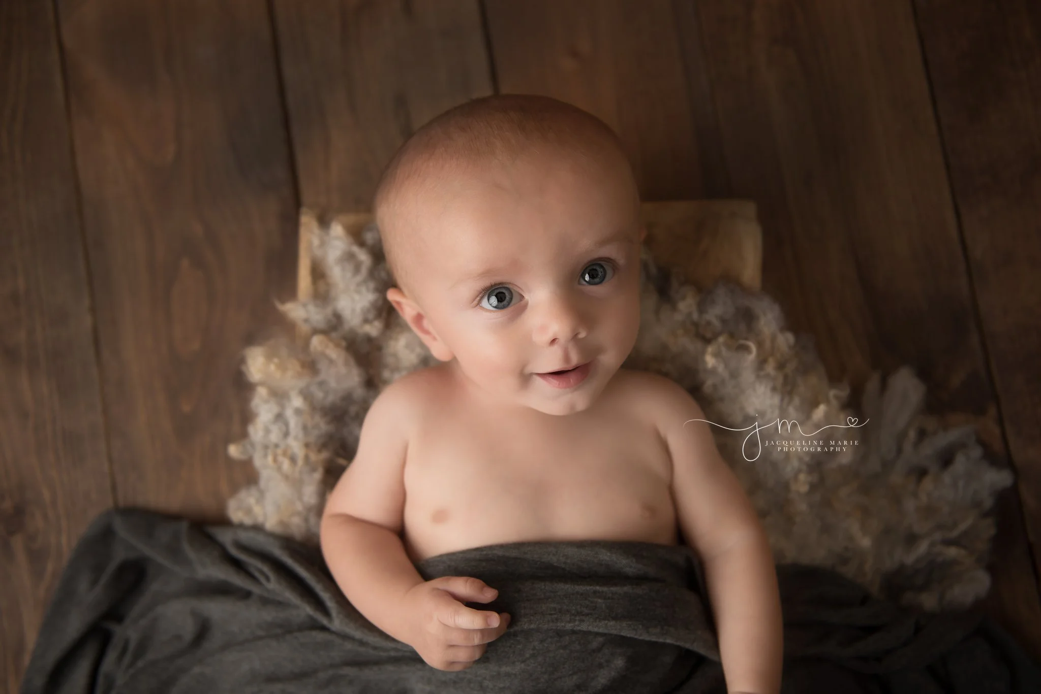 6 month old smiles during milestone baby photography session in columbus ohio