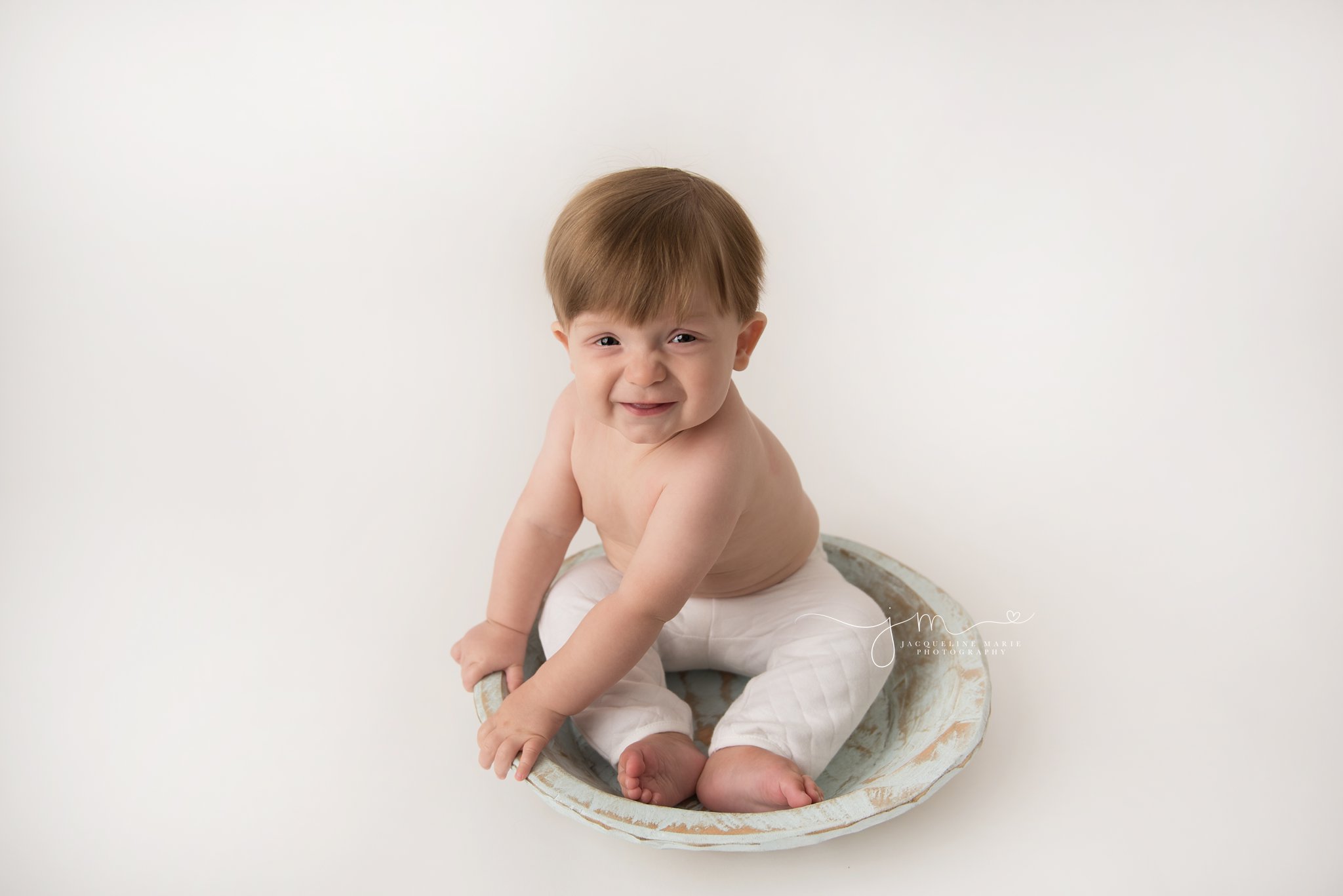 columbus ohio baby boy smiles and laughs during portrait session at jacqueline marie photography studio