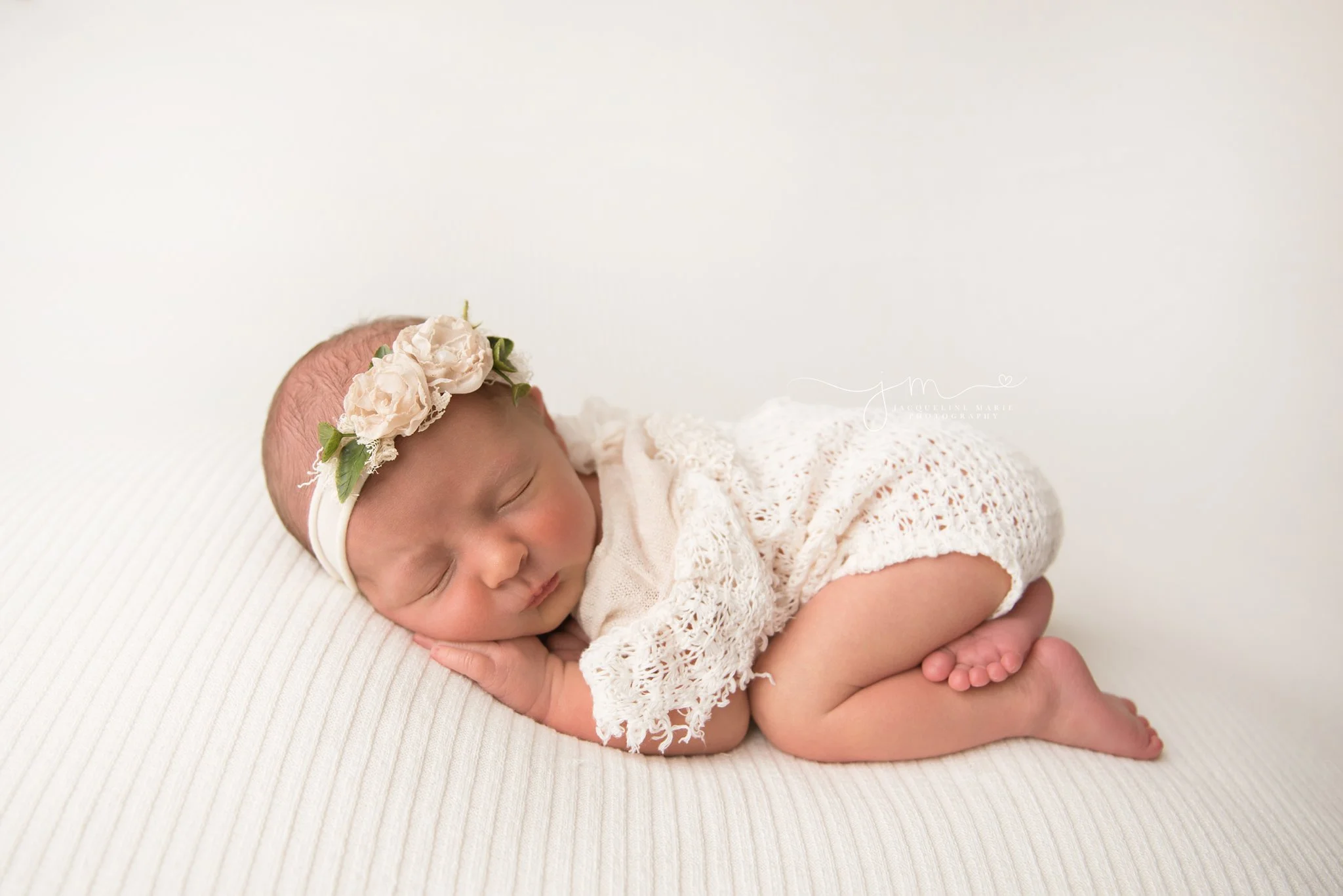 columbus ohio newborn photographer features images of baby girl in cream lace romper and toes resting on leg for newborn photography pictures