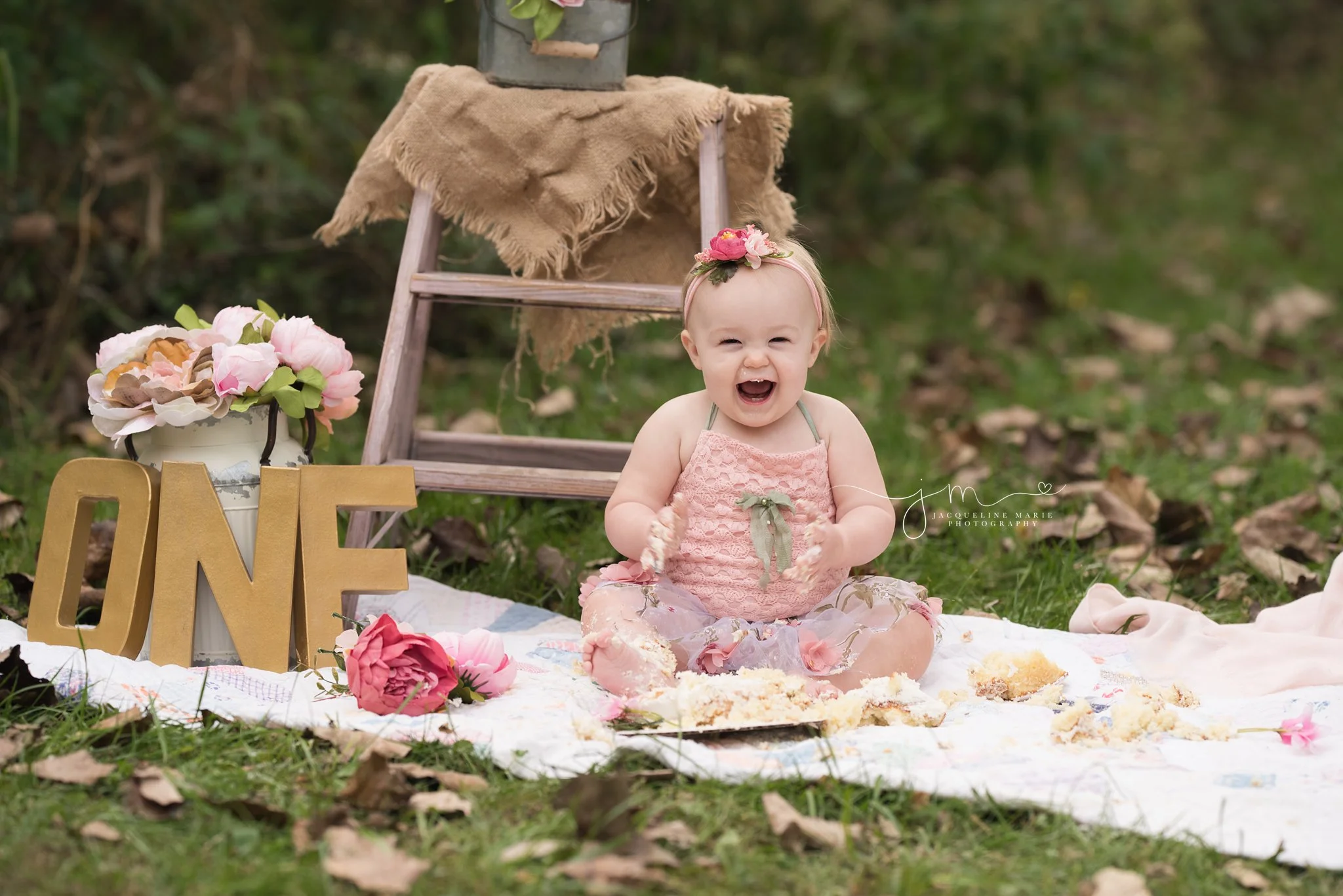 1 year old baby girl smiles and laughs for first birthday photos in columbus ohio