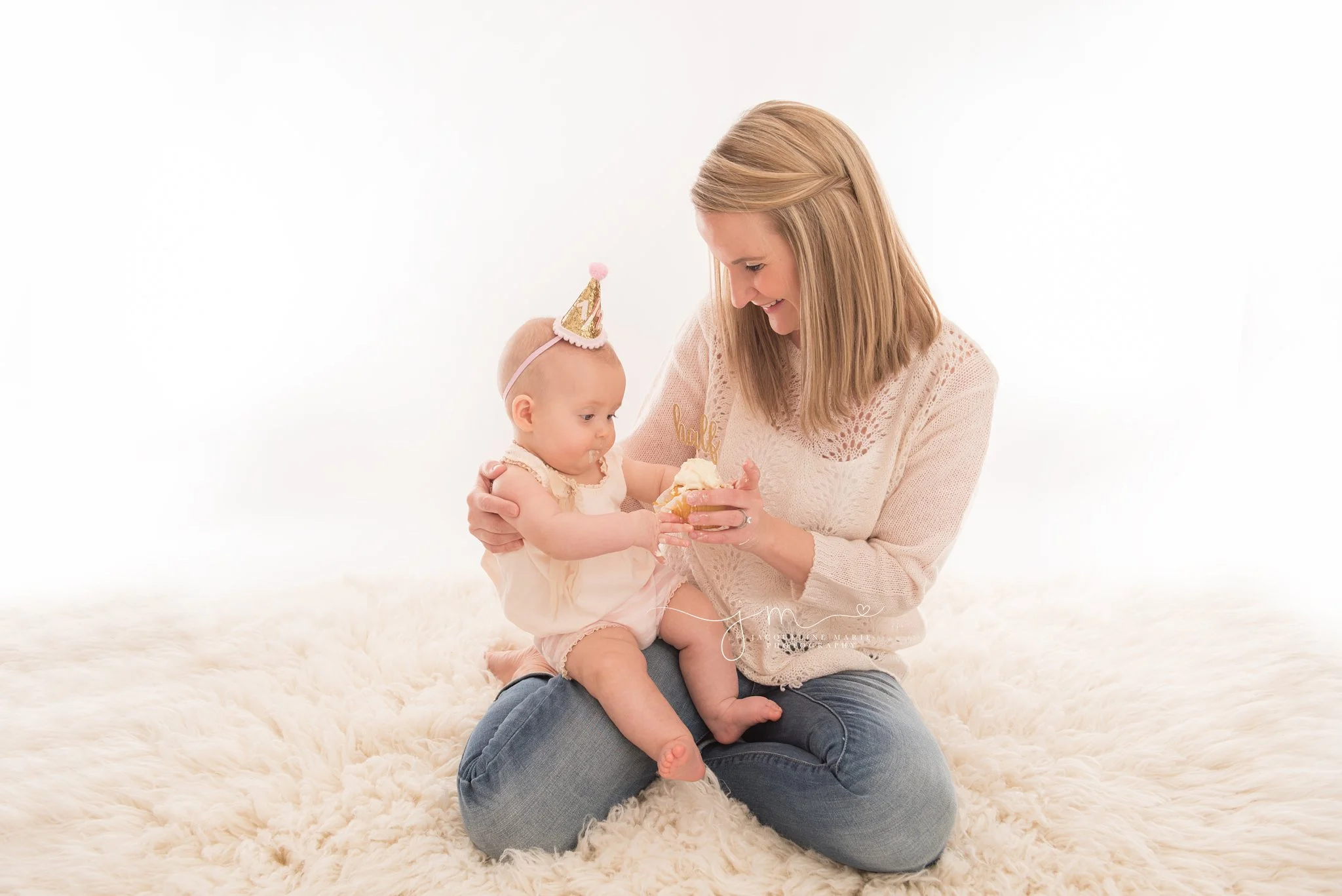 6 month old celebrates half birthday with a cupcake in columbus ohio photography studio