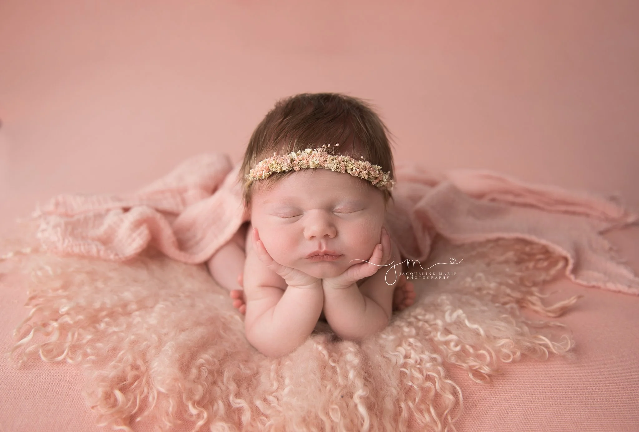 columbus ohio newborn baby girl wears pink floral crown for newborn portraits