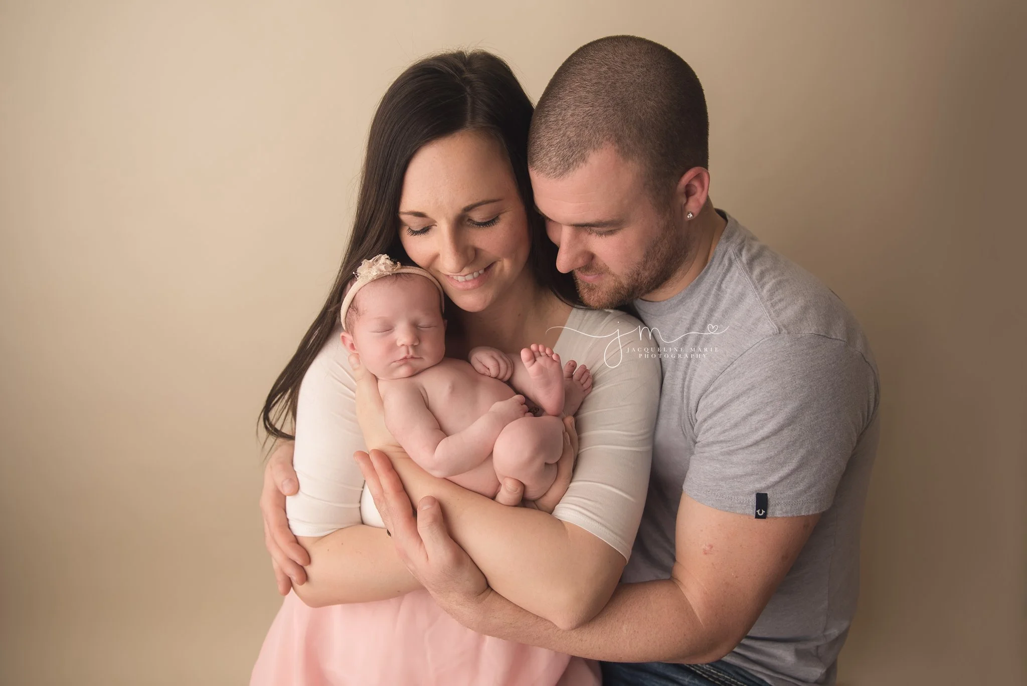 new parents hold newborn baby girl in columbus ohio